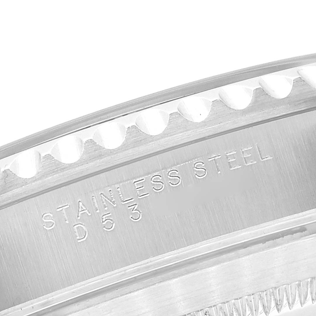 This is a close-up shot of the stainless steel engraved side of a Rolex Submariner 14060 Men
s Stainless Steel Black Dial 14060 Men
s Stainless Steel Black Dial watch case.