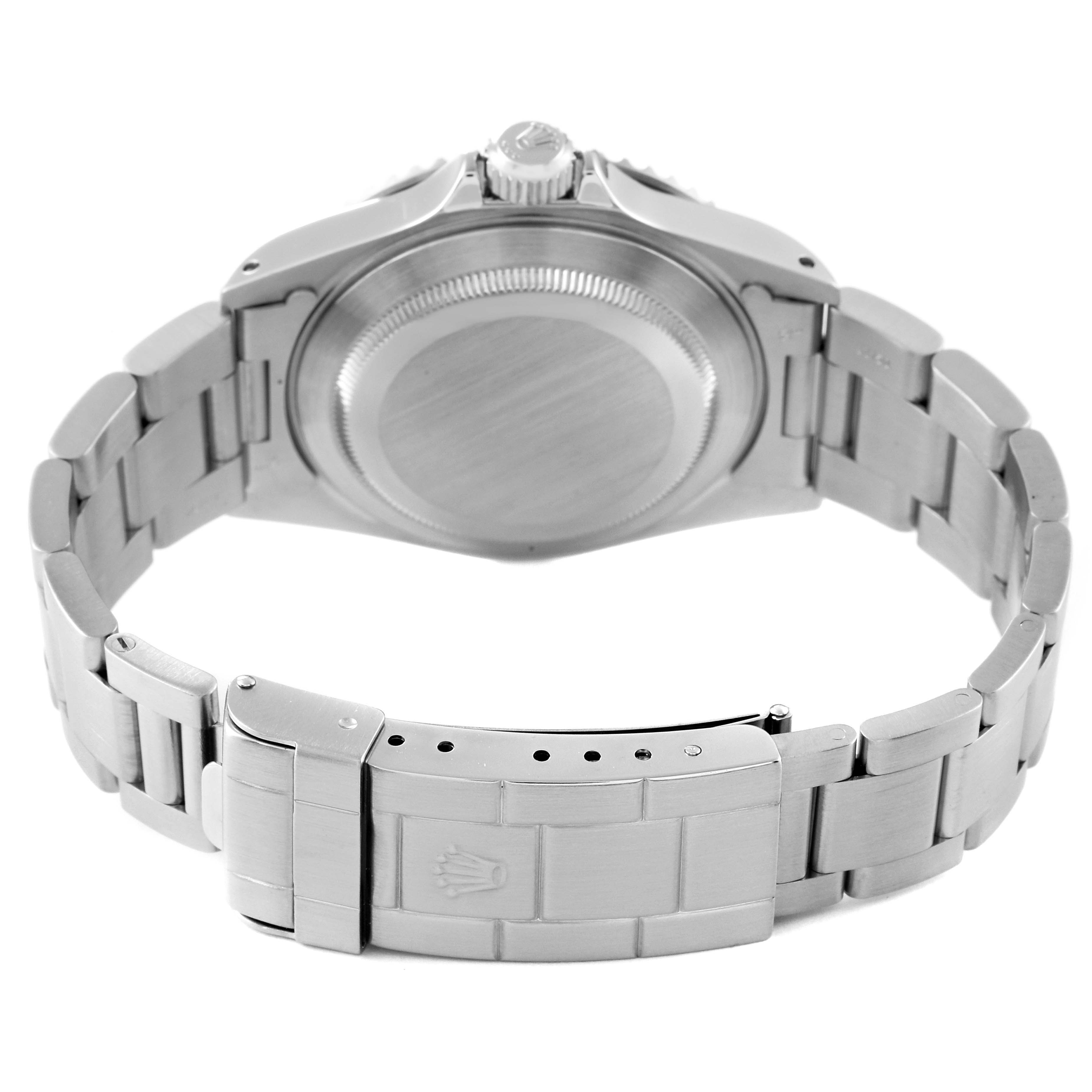 The image shows the rear view of a Rolex Submariner 14060 Men
s Stainless Steel Black Dial 14060 Men
s Stainless Steel Black Dial, highlighting its closed caseback and metal bracelet with clasp.