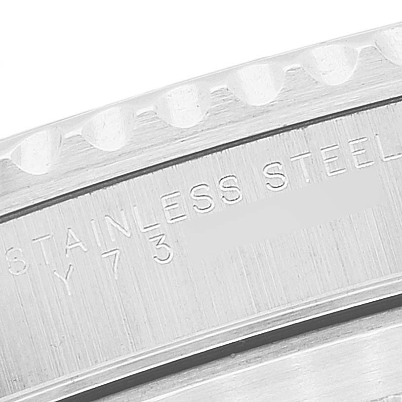 This close-up image shows the side of the bezel and part of the case body with engraving of the Rolex Submariner 14060 Men
s Stainless Steel Black Dial 14060 Men
s Stainless Steel Black Dial
s stainless steel material.