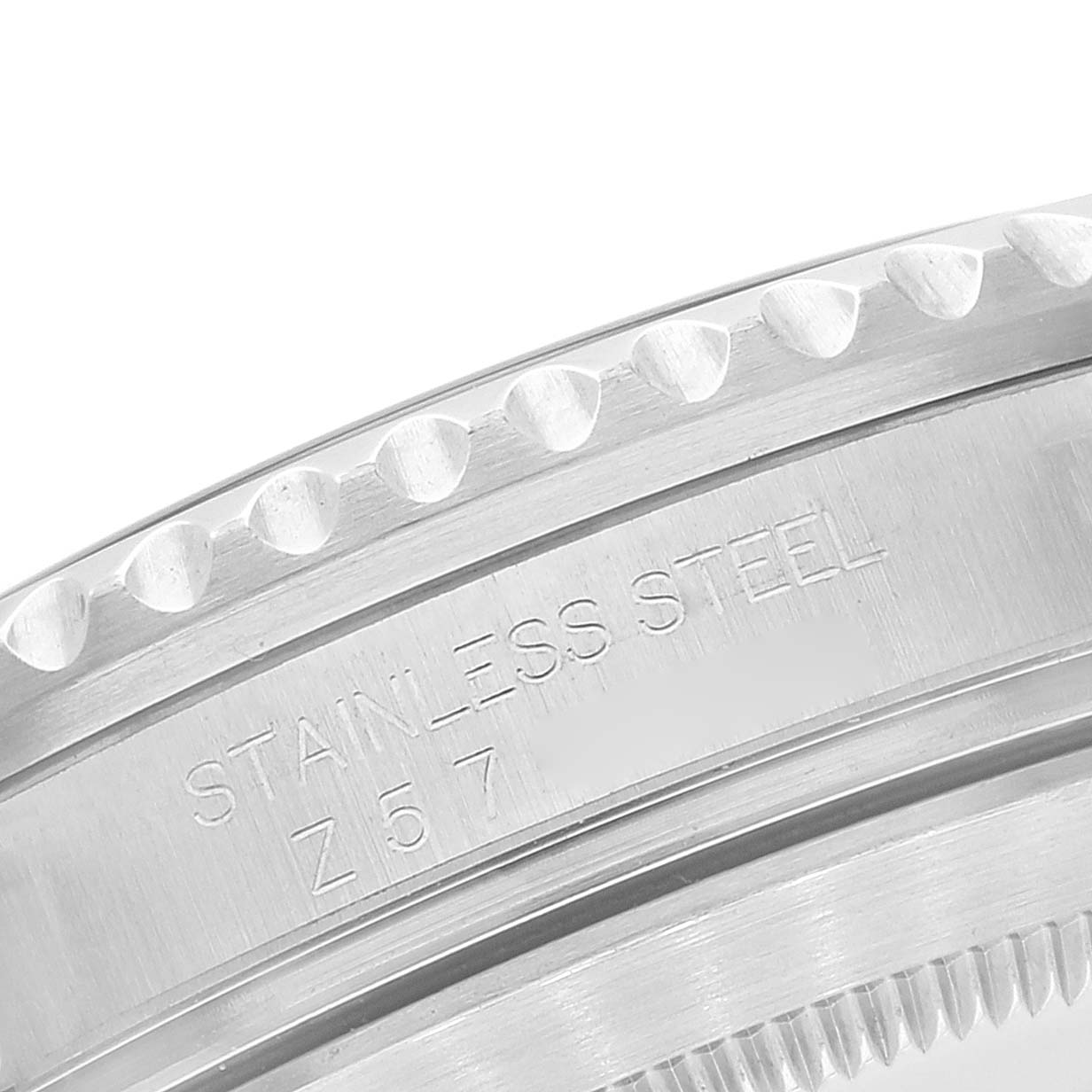 This image shows a close-up, angled view of the stainless steel bezel and engraved markings of a Rolex Submariner 16610 Men
s Stainless Steel Black Dial 16610 Men
s Stainless Steel Black Dial watch.