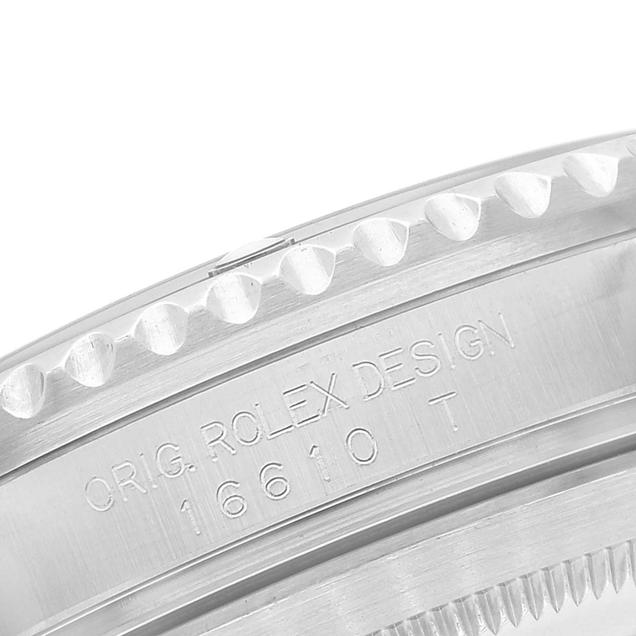 The image shows the engraved case back and bezel of a Rolex Submariner 16610 Men
s Stainless Steel Black Dial 16610 Men
s Stainless Steel Black Dial model, highlighting the design and model number.