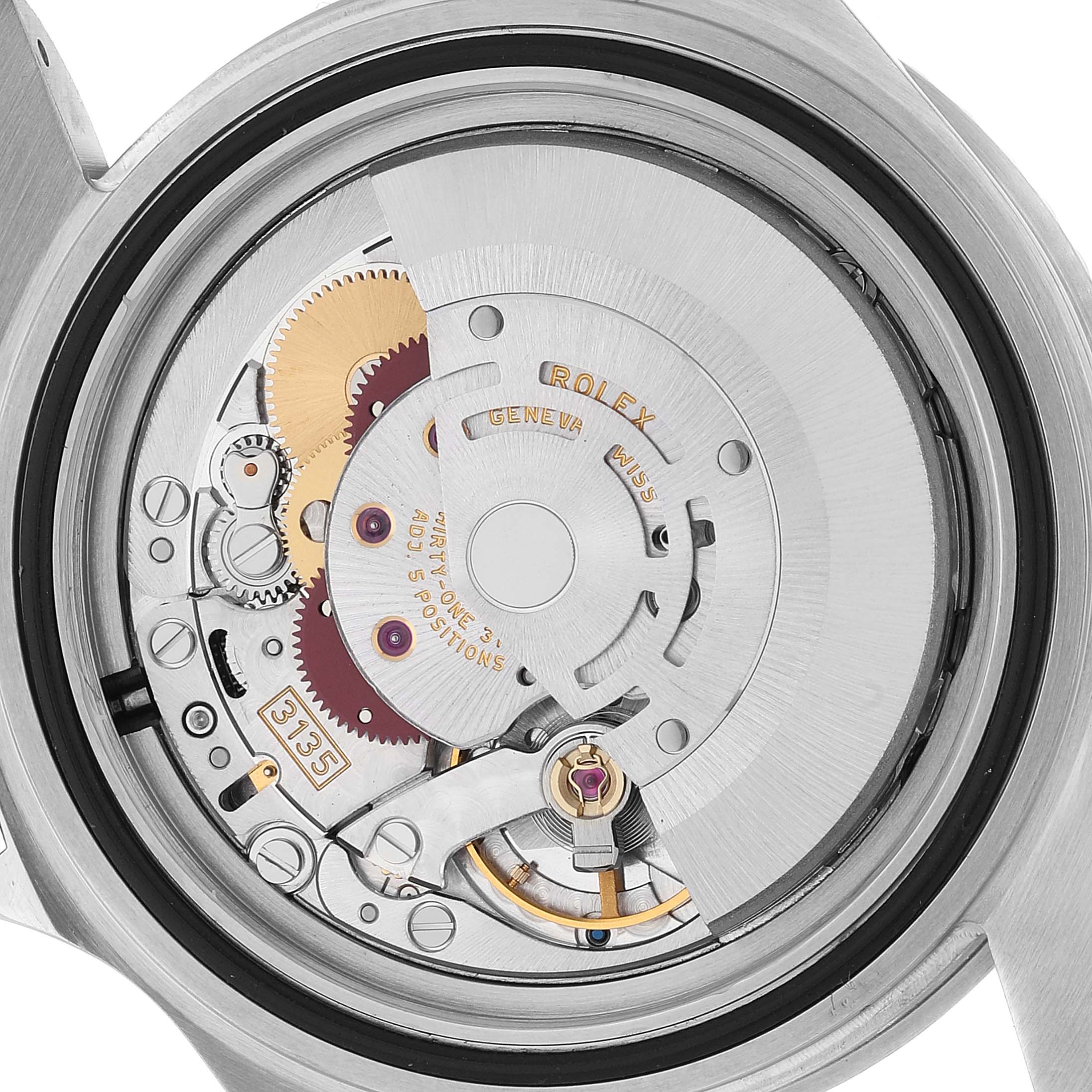 It shows an inside view of the movement mechanism of a Rolex Submariner 16610 Men
s Stainless Steel Black Dial 16610 Men
s Stainless Steel Black Dial watch, including gears and springs.
