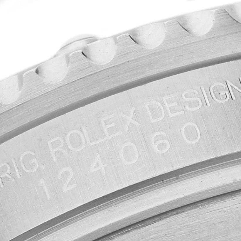 The image shows a close-up of the side engraving on a Rolex Submariner 124060 Men's Stainless Steel Black Dial, highlighting the model number.