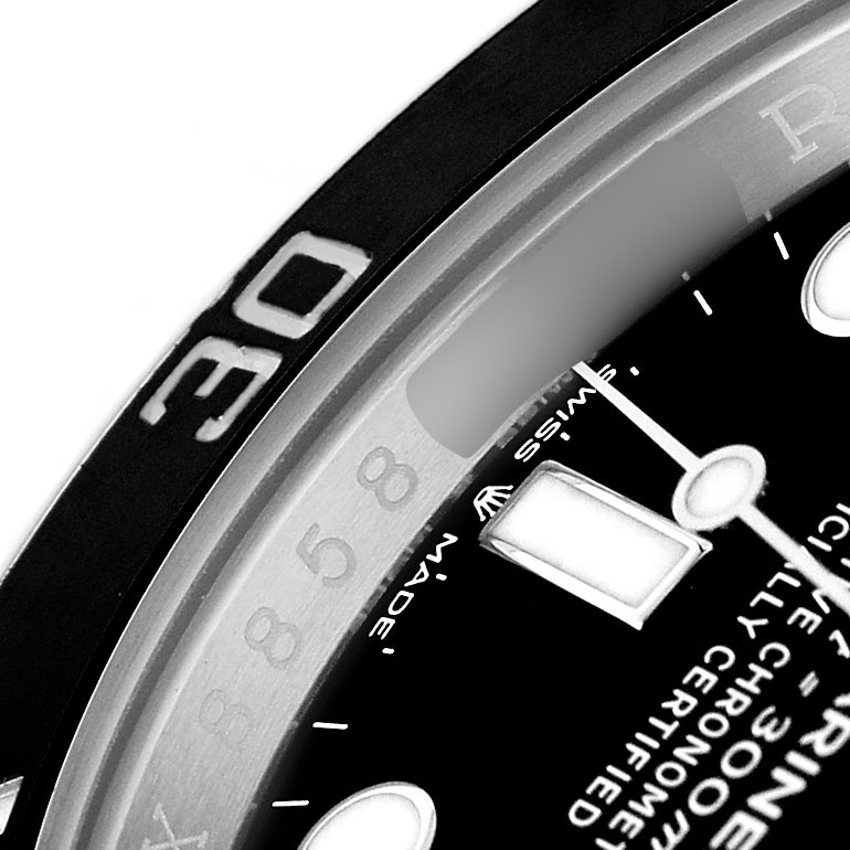 The image shows a close-up of the Rolex Submariner 124060 Men's Stainless Steel Black Dial's bezel and partial dial, highlighting the numerals and markers.