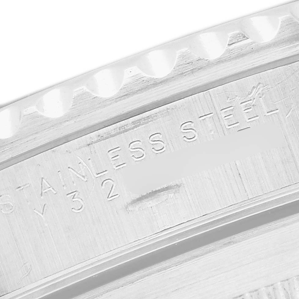 The image shows a close-up of the side engraving on the stainless steel case of a Rolex Submariner 14060 Men
s Stainless Steel Black Dial.