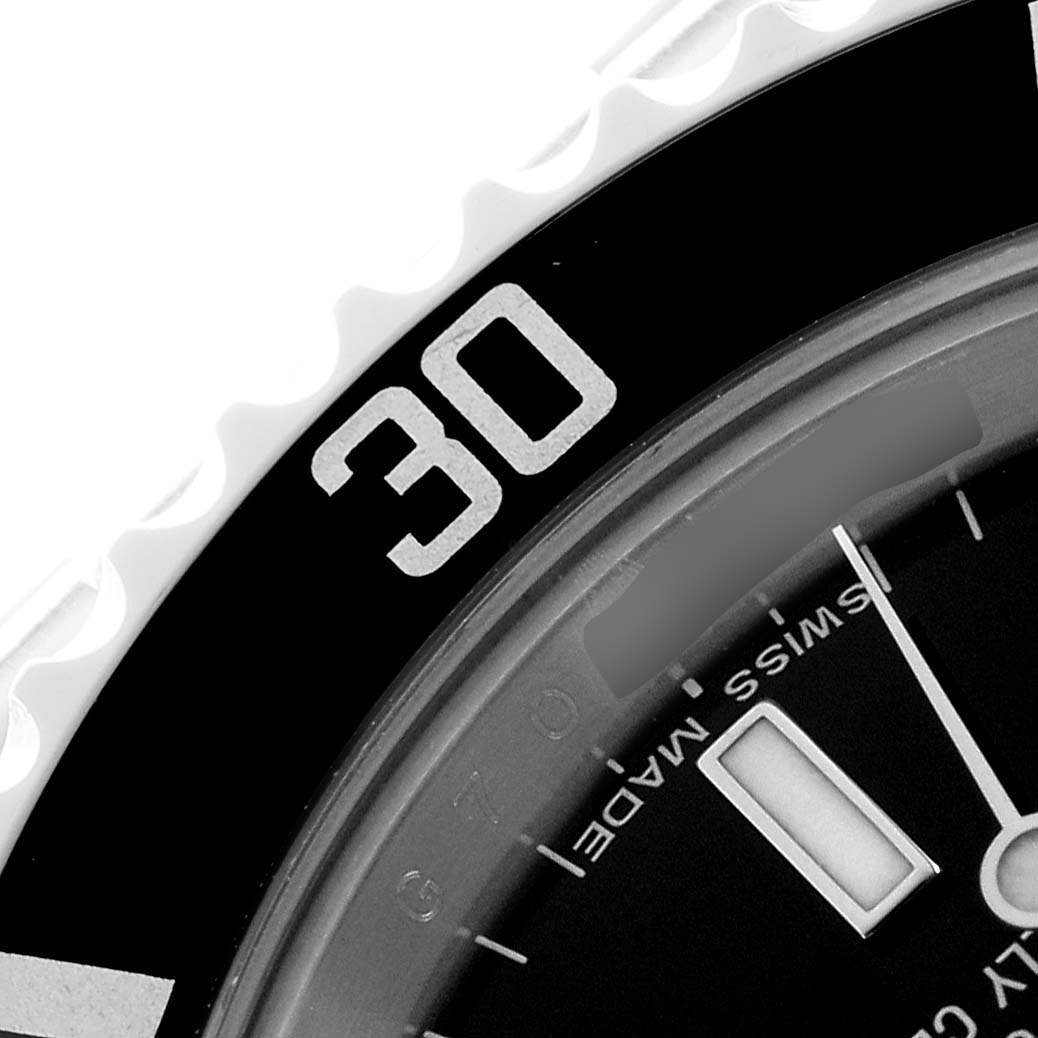 The image shows a close-up of the bezel and dial of the Rolex Submariner 14060 Men
s Stainless Steel Black Dial, highlighting the "30" marker and part of the hour markers.
