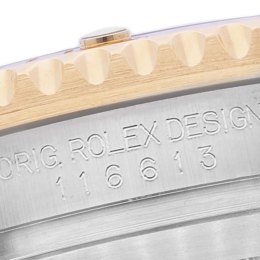 The image shows a close-up of the case side and bezel of a Rolex Submariner 116613 Men's Steel and Gold (two tone) Blue Dial 116613 Men's Steel and Gold (two tone) Blue Dial, highlighting the model number engraving.