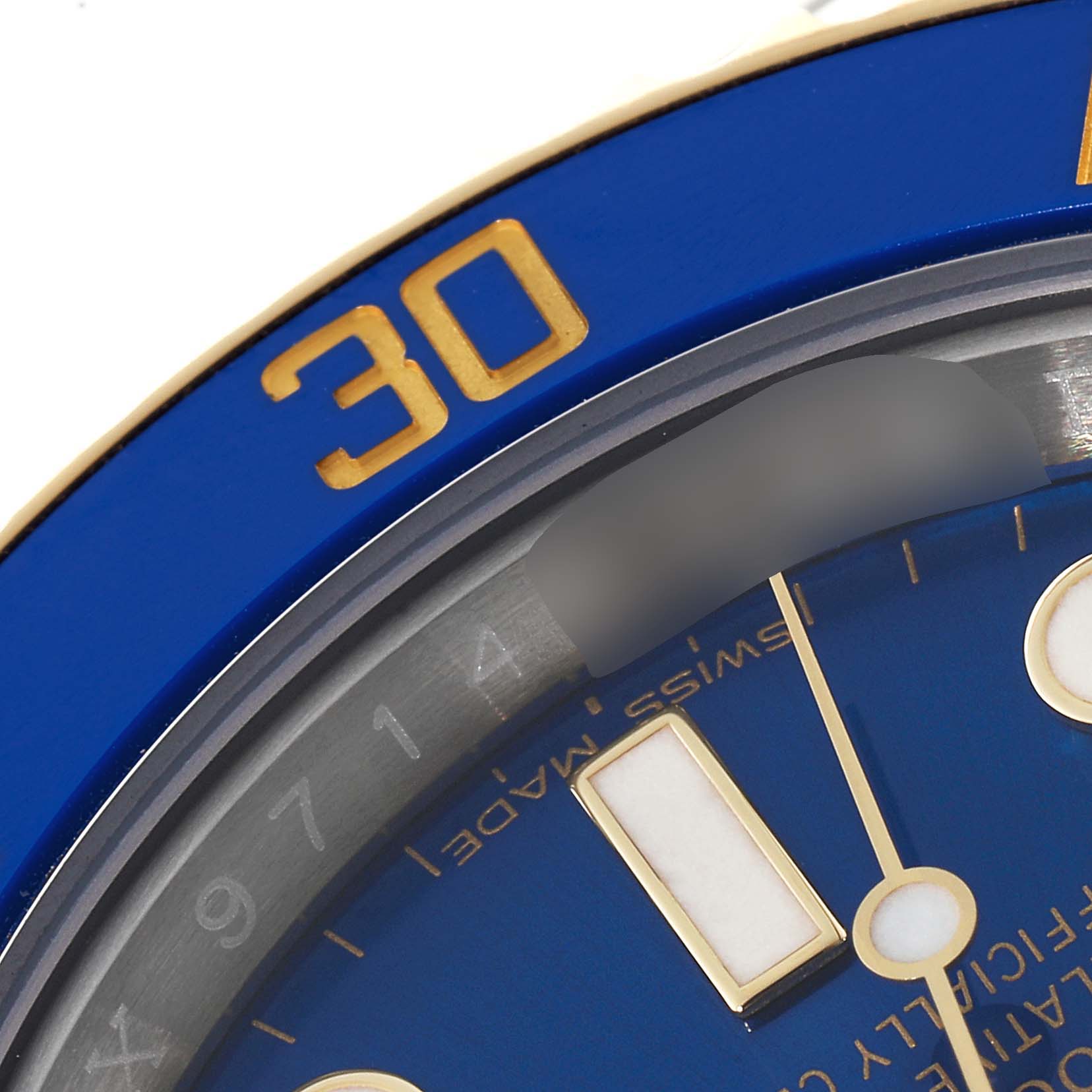 This close-up image of the Rolex Submariner 116613 Men's Steel and Gold (two tone) Blue Dial 116613 Men's Steel and Gold (two tone) Blue Dial shows its blue bezel with the "30" marker and part of its blue, detailed dial.