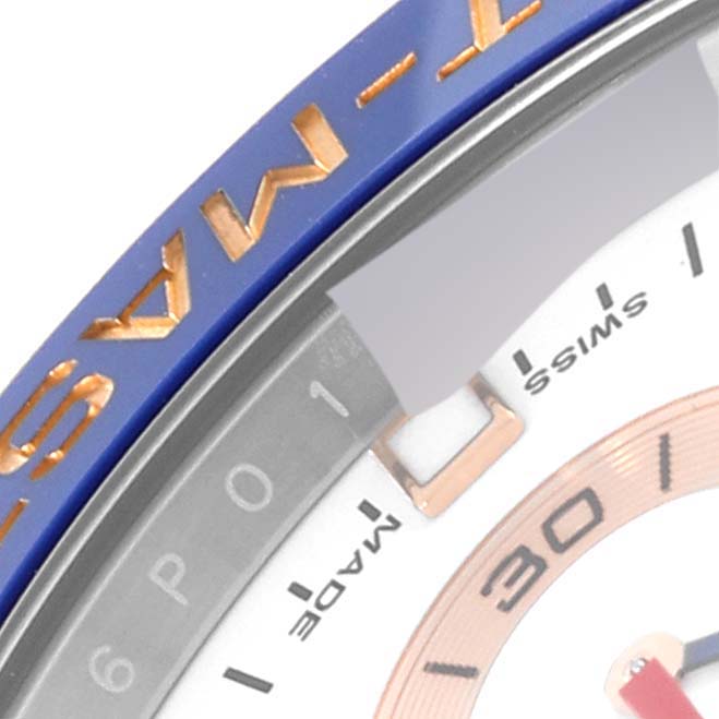 The image shows a partial view of the bezel and dial of a Rolex Yacht-Master 116681 Men
s Steel and Gold (two tone) White Dial 116681 Men
s Steel and Gold (two tone) White Dial watch.