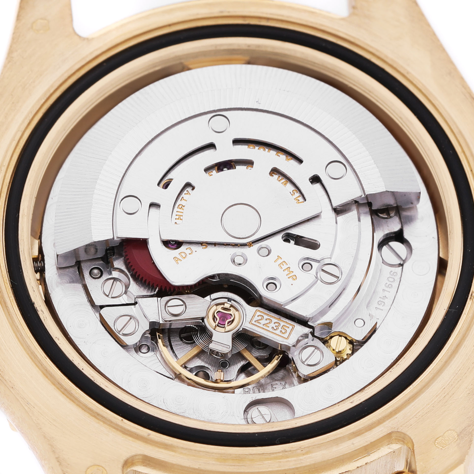 The image shows the movement of a Rolex Yacht-Master 168628 Women's Yellow Gold Mother of Pearl Dial watch from a back angle, highlighting its intricate components.