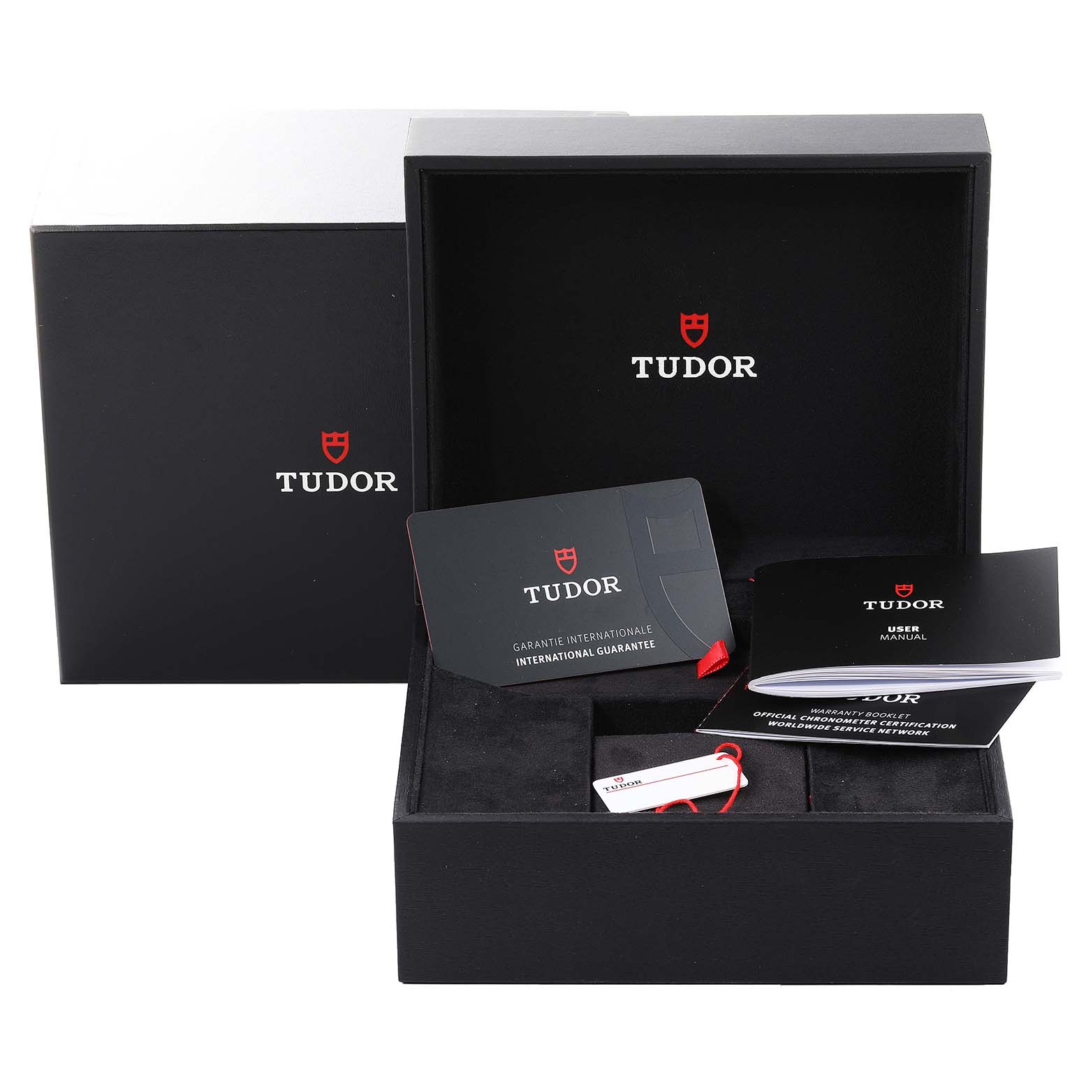 The image shows the packaging, international guarantee card, user manual, and authenticity tag of the Tudor Heritage Black Bay 79830RB Men's Stainless Steel Black Dial 79830RB Men's Stainless Steel Black Dial watch.