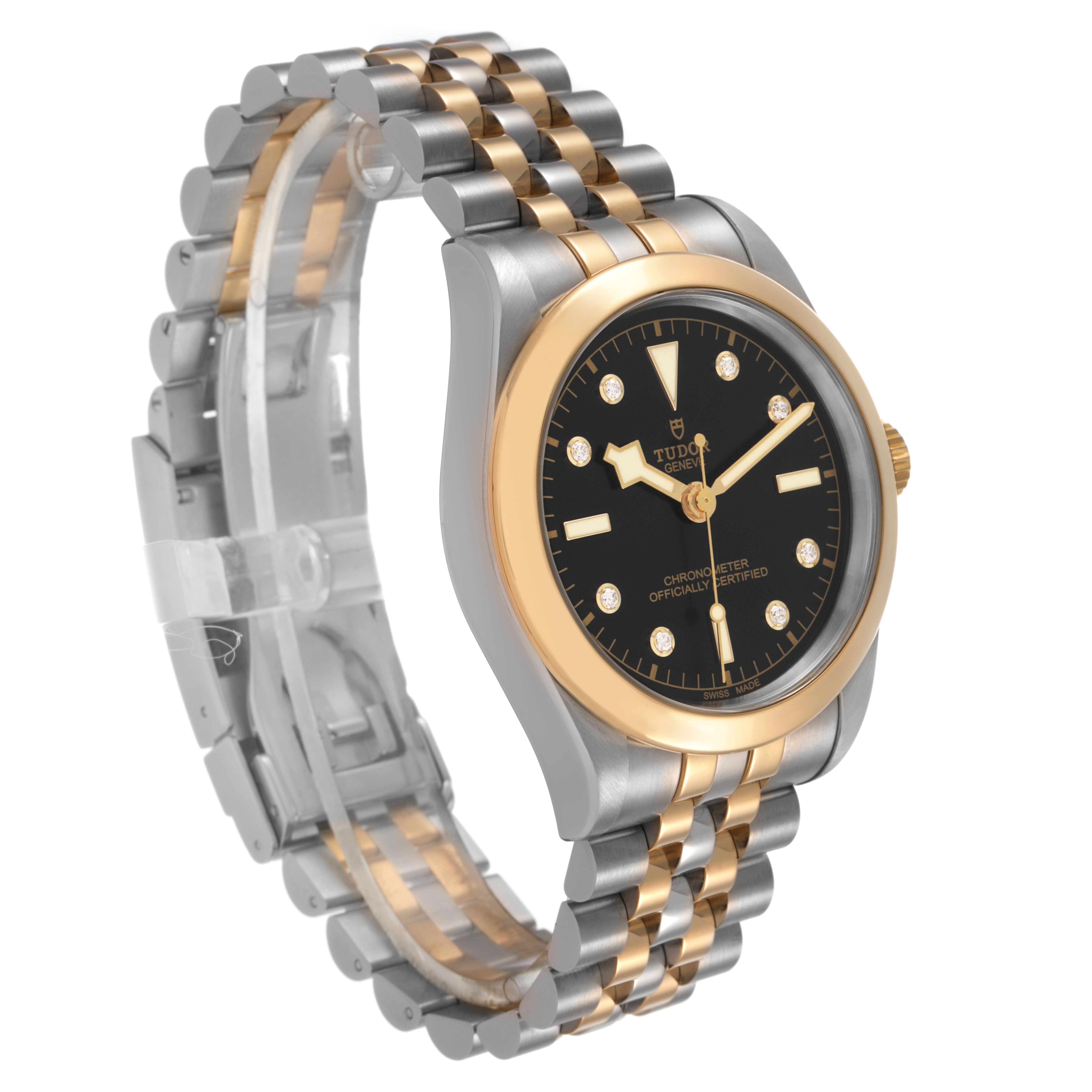 The Tudor Heritage Black Bay 79663 Men's Steel and Gold (two tone) Black Dial watch is shown at a three-quarter angle, highlighting the case, bracelet, and dial details.
