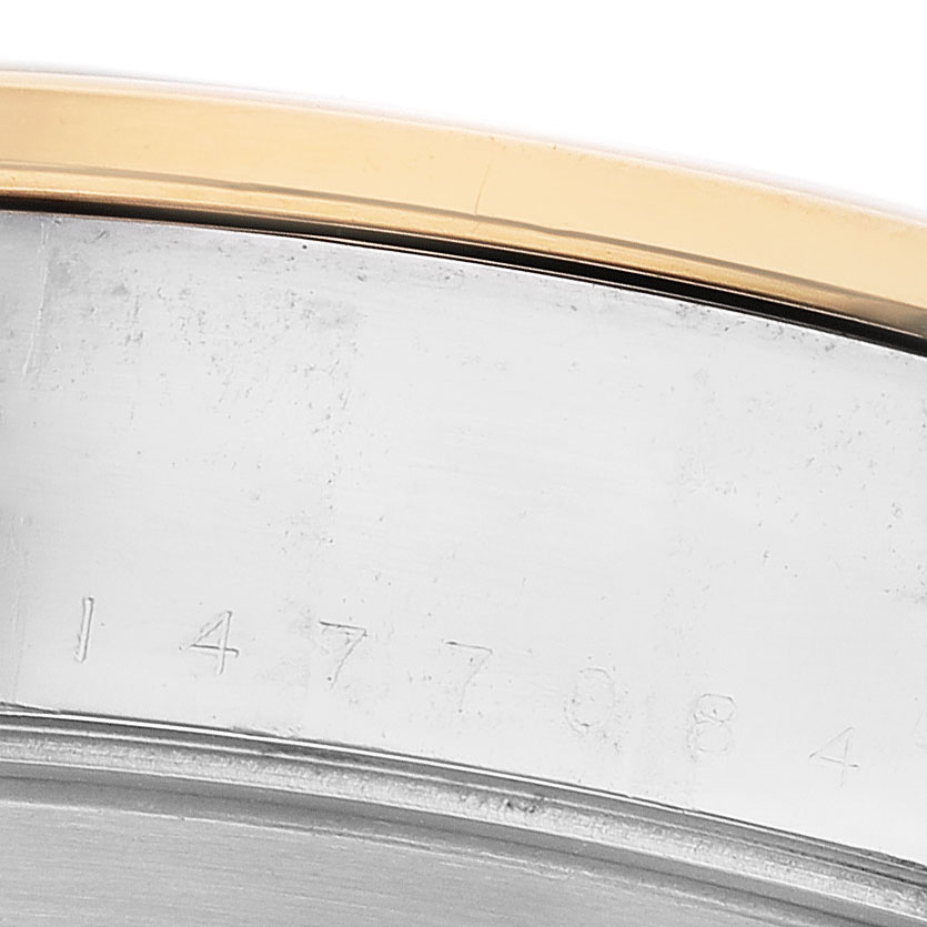 The image shows a close-up of the side of a Tudor Heritage Black Bay 79663 Men's Steel and Gold (two tone) Black Dial watch case, highlighting the serial number engraving and edge of the bezel.