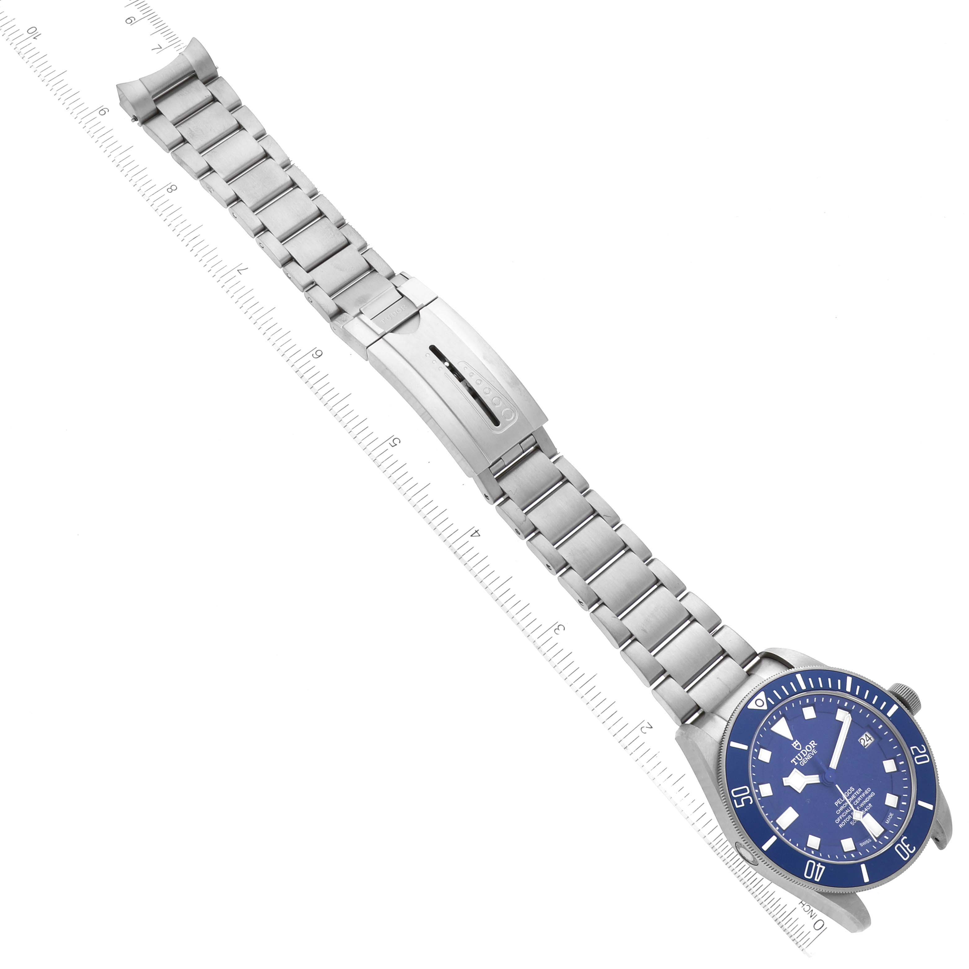 The Tudor Pelagos 25600TB Men's Titanium Blue Dial 25600TB Men's Titanium Blue Dial watch is shown from a top-down angle, displaying the face, bezel, and entire metal bracelet.
