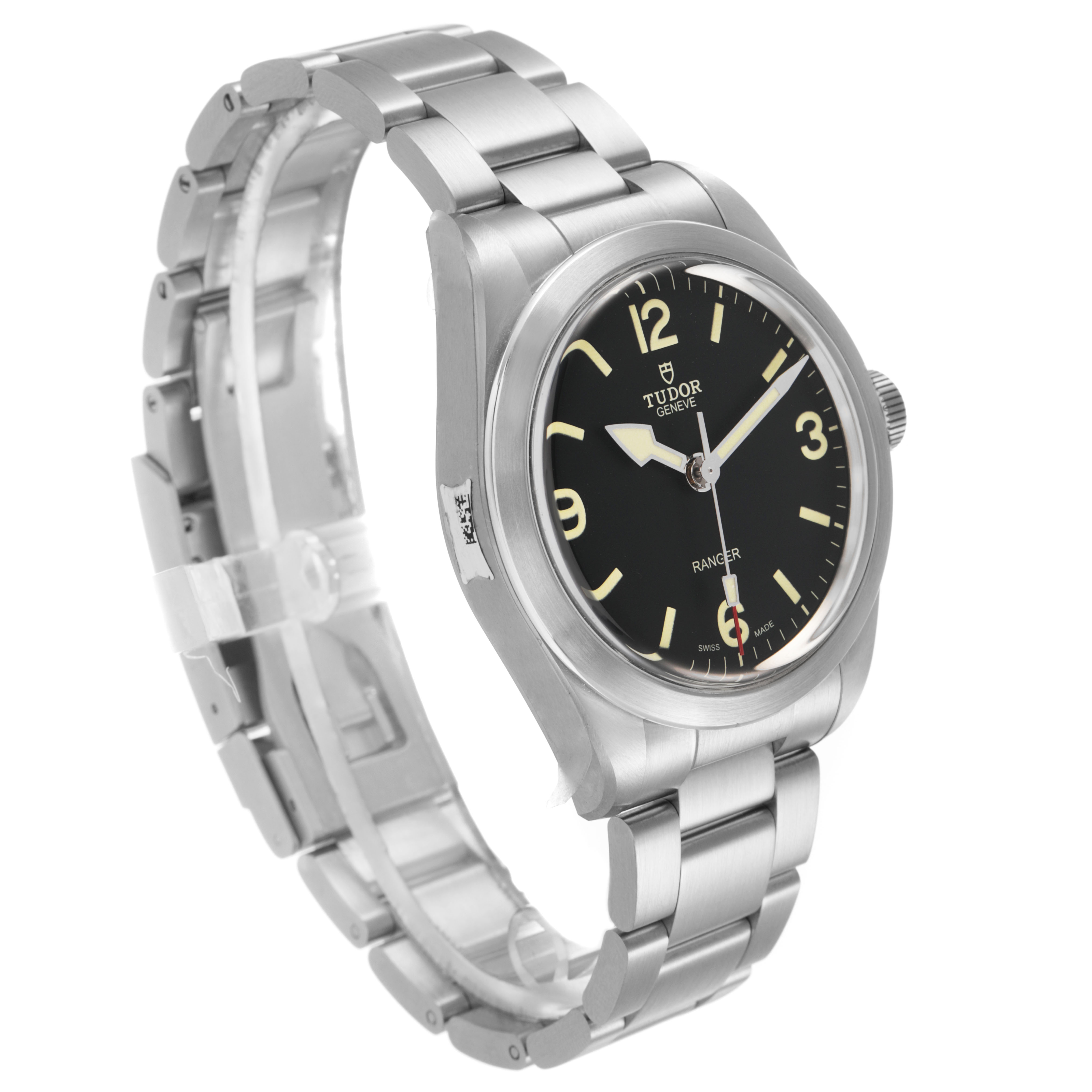 The Tudor Heritage Ranger 79950 Men's Stainless Steel Black Dial watch is shown at an oblique angle, highlighting the dial, case, and bracelet.