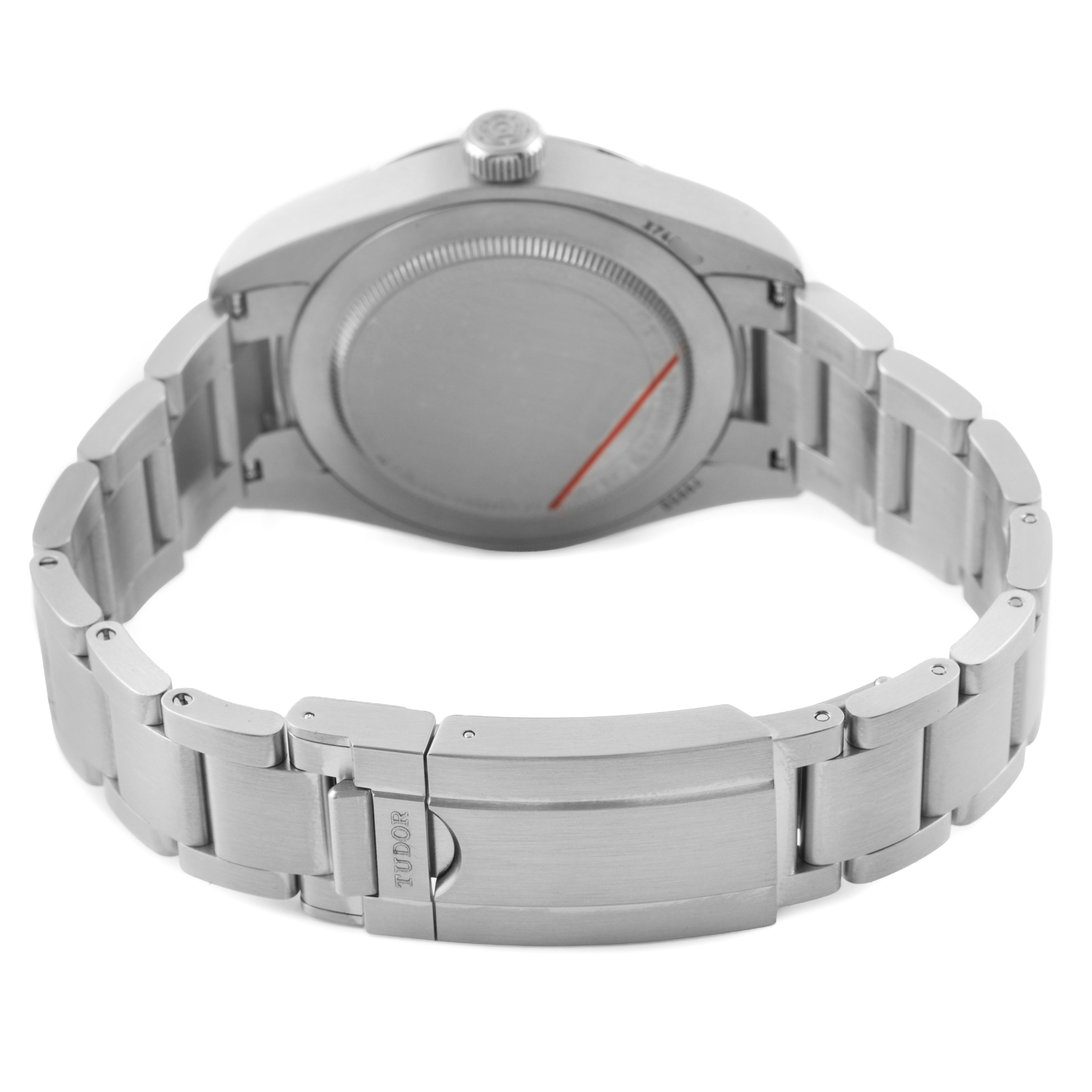 The Tudor Heritage Ranger 79950 Men's Stainless Steel Black Dial watch is shown from the back, highlighting its stainless steel case back and bracelet clasp.