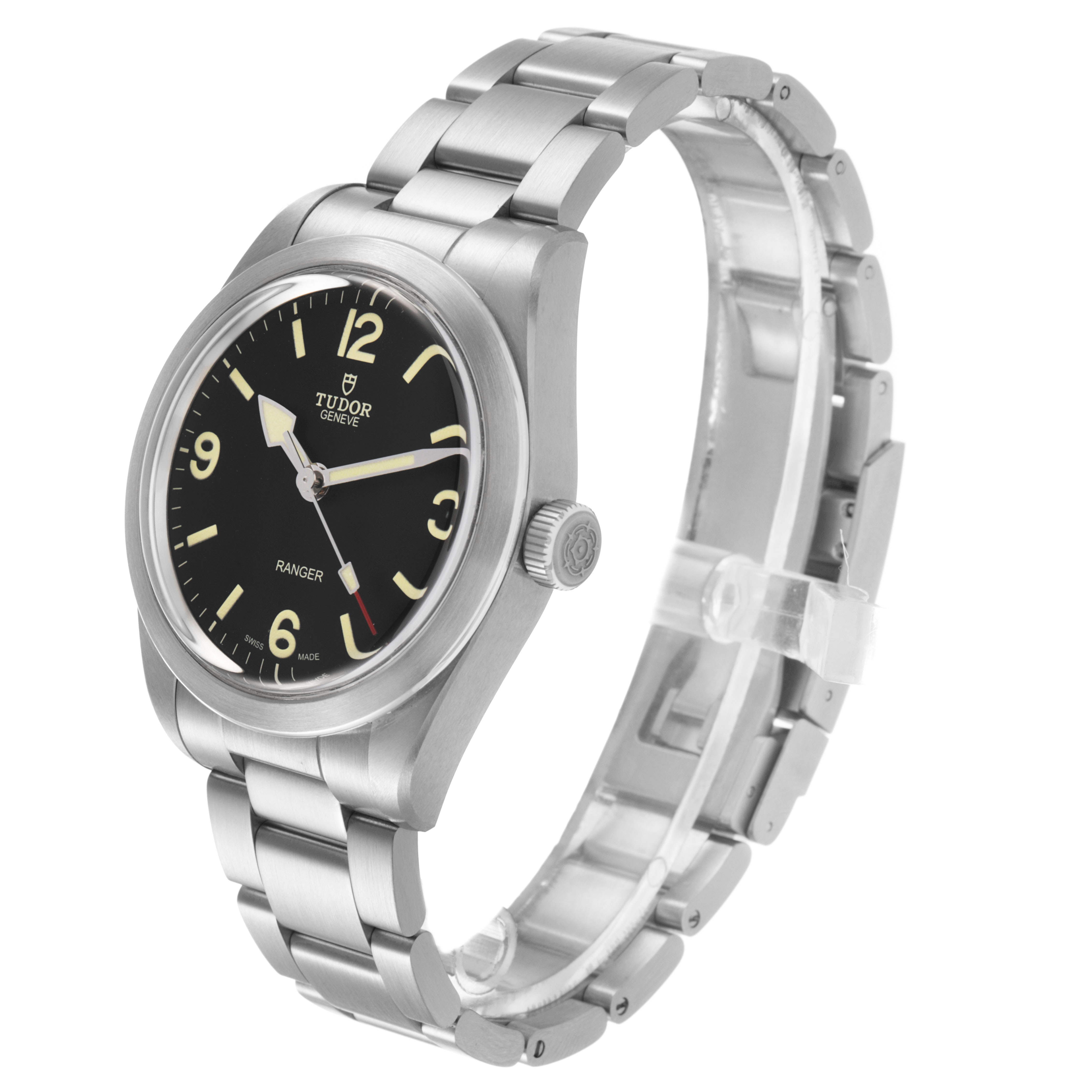 The Tudor Heritage Ranger 79950 Men's Stainless Steel Black Dial watch is shown from a three-quarter angle, displaying the dial, case, bracelet, and crown.