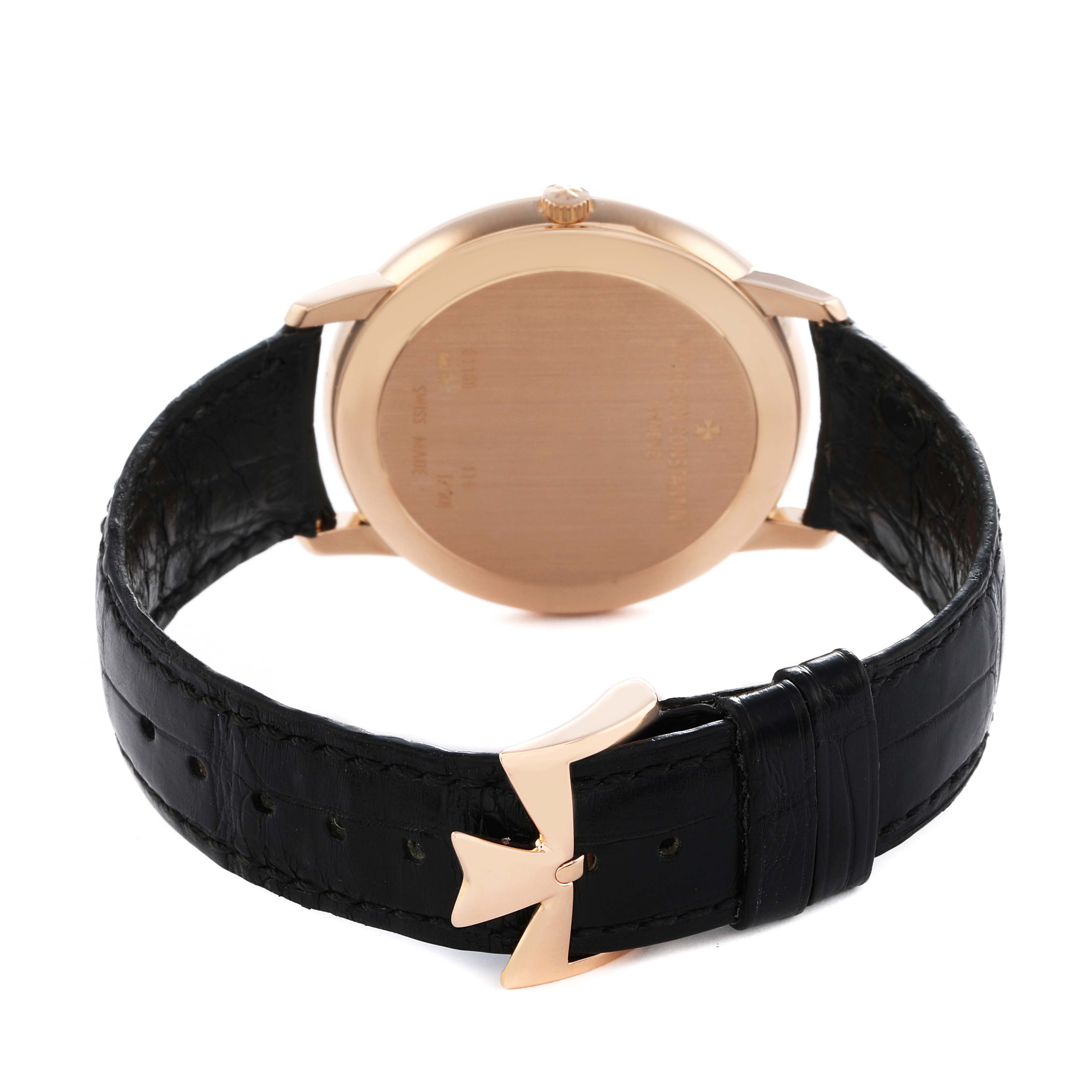 The image shows the back view of a Vacheron Constantin Patrimony 81180/000R-9159 Men
s Rose Gold Silver Dial watch, highlighting the case back and leather strap with a distinctive clasp.