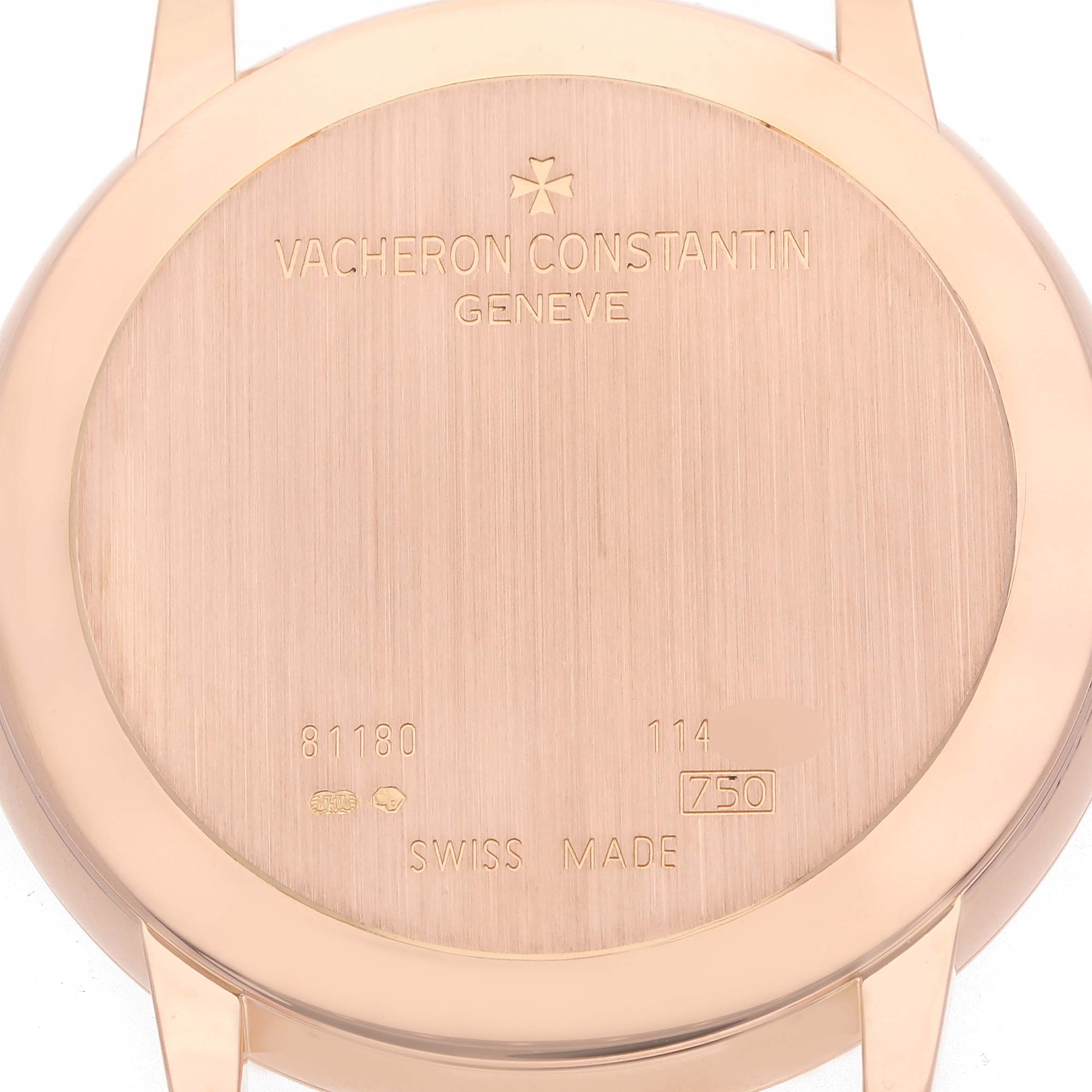 The image shows the back of a Vacheron Constantin Patrimony 81180/000R-9159 Men
s Rose Gold Silver Dial watch, featuring the brand, model details, and "Swiss Made" engraving.
