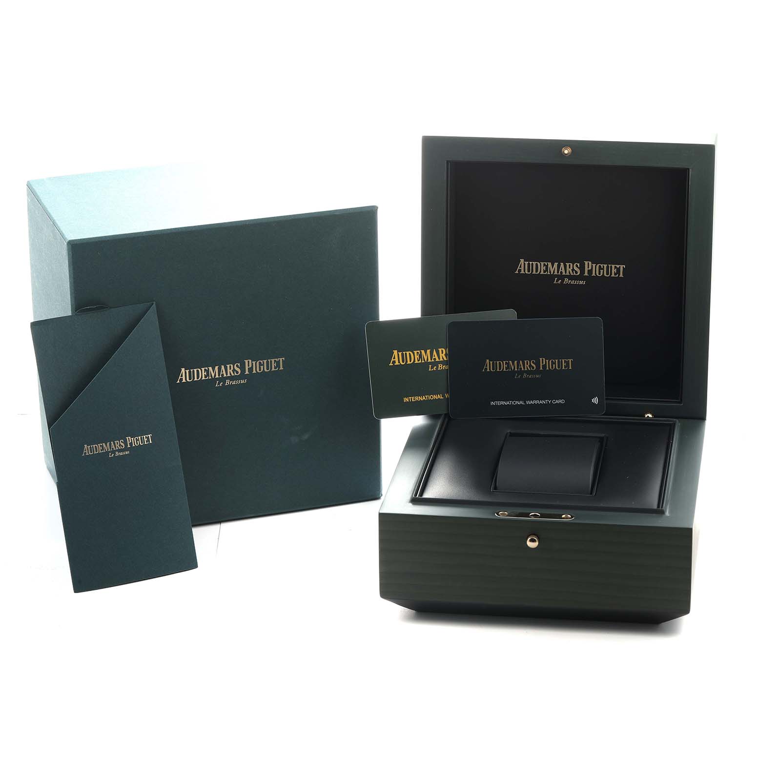 The image shows the packaging and accessories for the Jules model by Audemars Piguet, including the box, warranty card, and booklet.