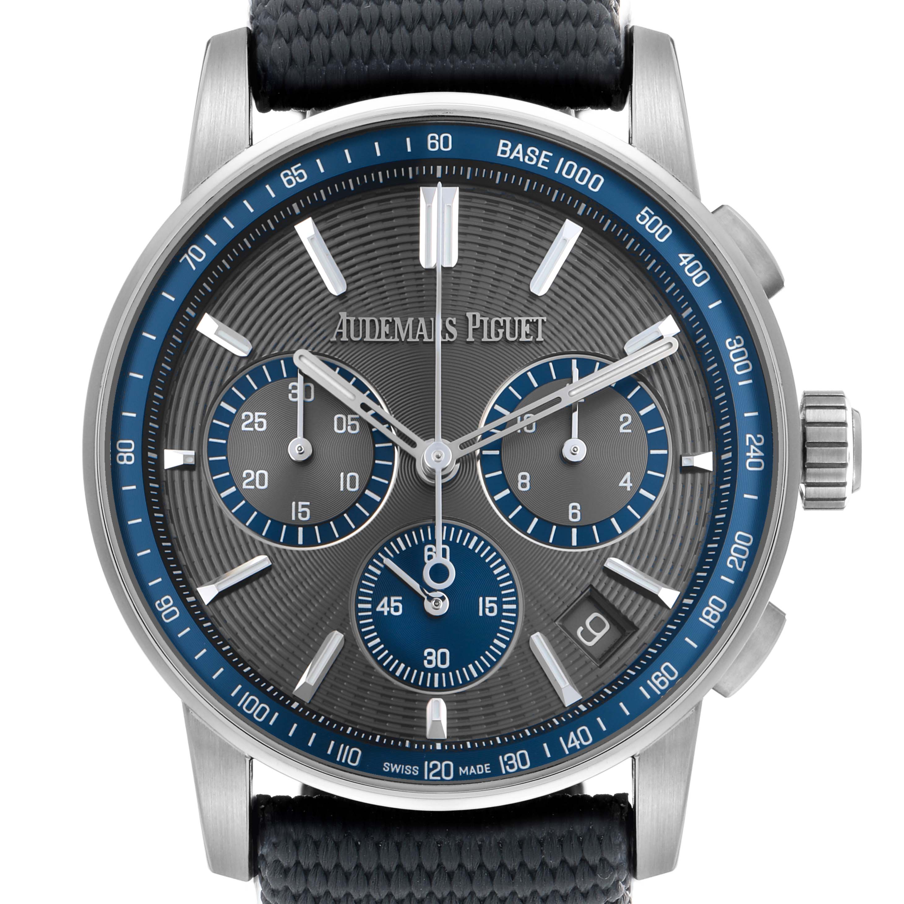 The image shows a front view of the Audemars Piguet Jules 26393ST Men's Stainless Steel Grey Dial watch, highlighting its dial, crown, subdials, and strap.