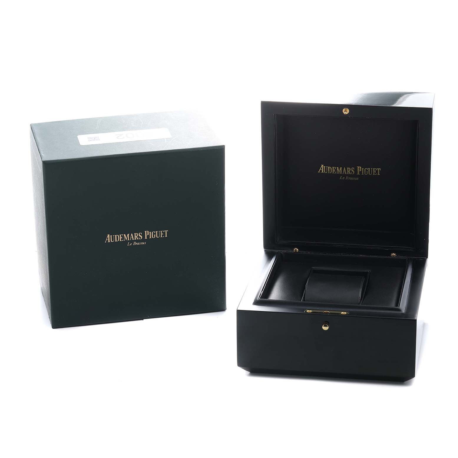 The image shows the packaging for a Royal Oak Offshore by Audemars Piguet, including a closed outer box and an open inner box.