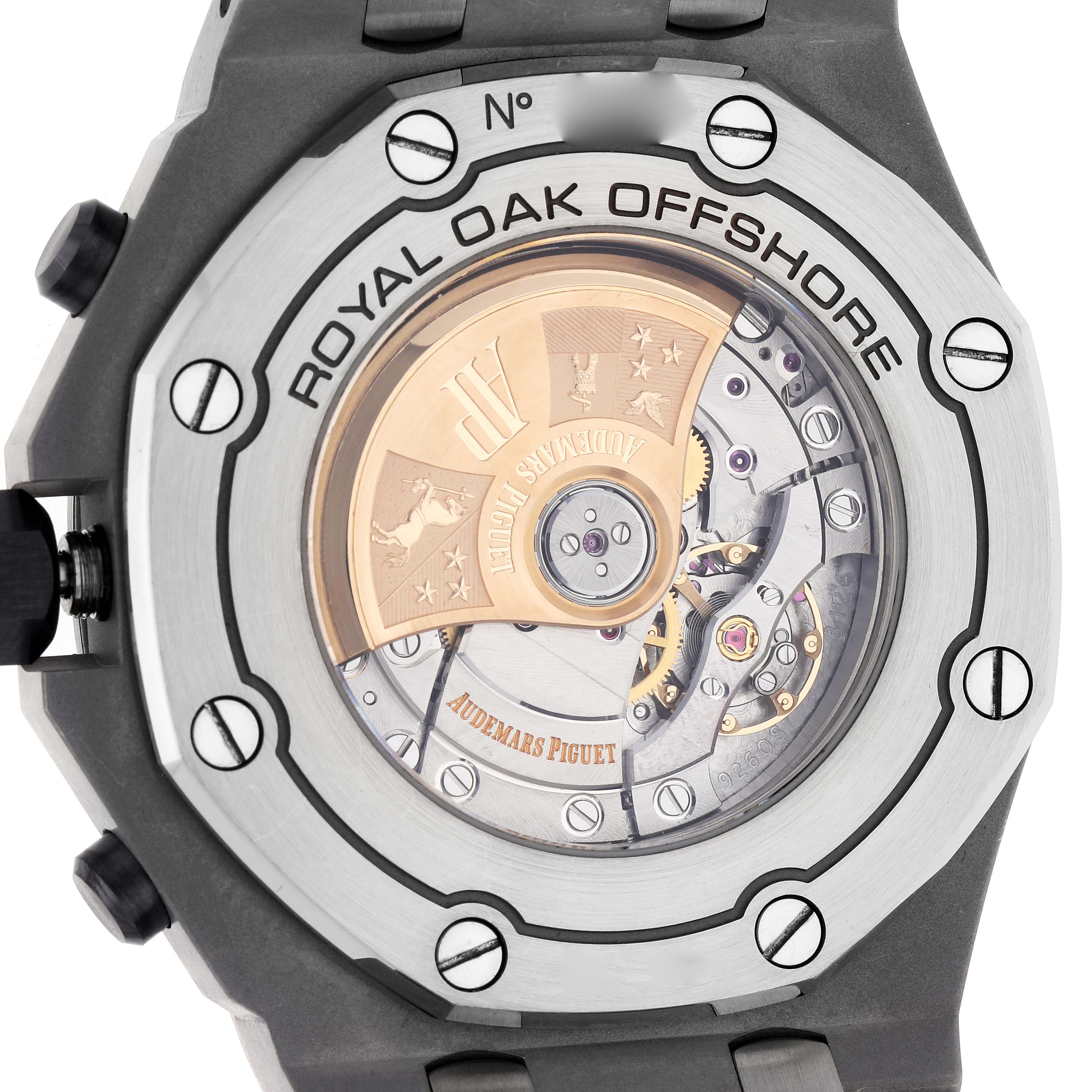 The image shows the back of an Audemars Piguet Royal Oak Offshore 26470ST.OO.A801CR.01 Men's Stainless Steel Beige Dial watch, highlighting the movement and engravings.