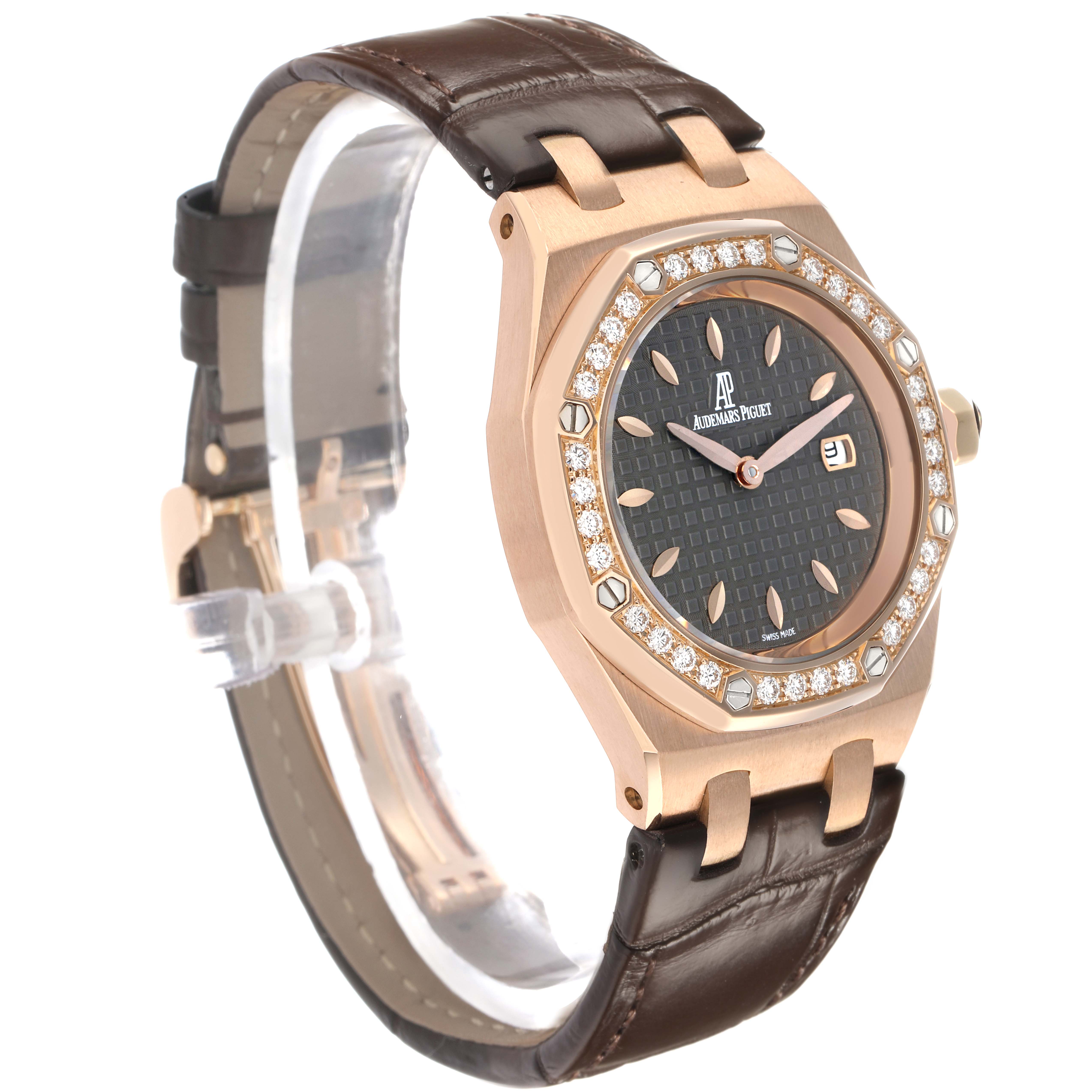 The Audemars Piguet Royal Oak 67621OR Women's Rose Gold Grey Dial watch is shown at a three-quarter angle, displaying the face, diamond-set bezel, and leather strap.