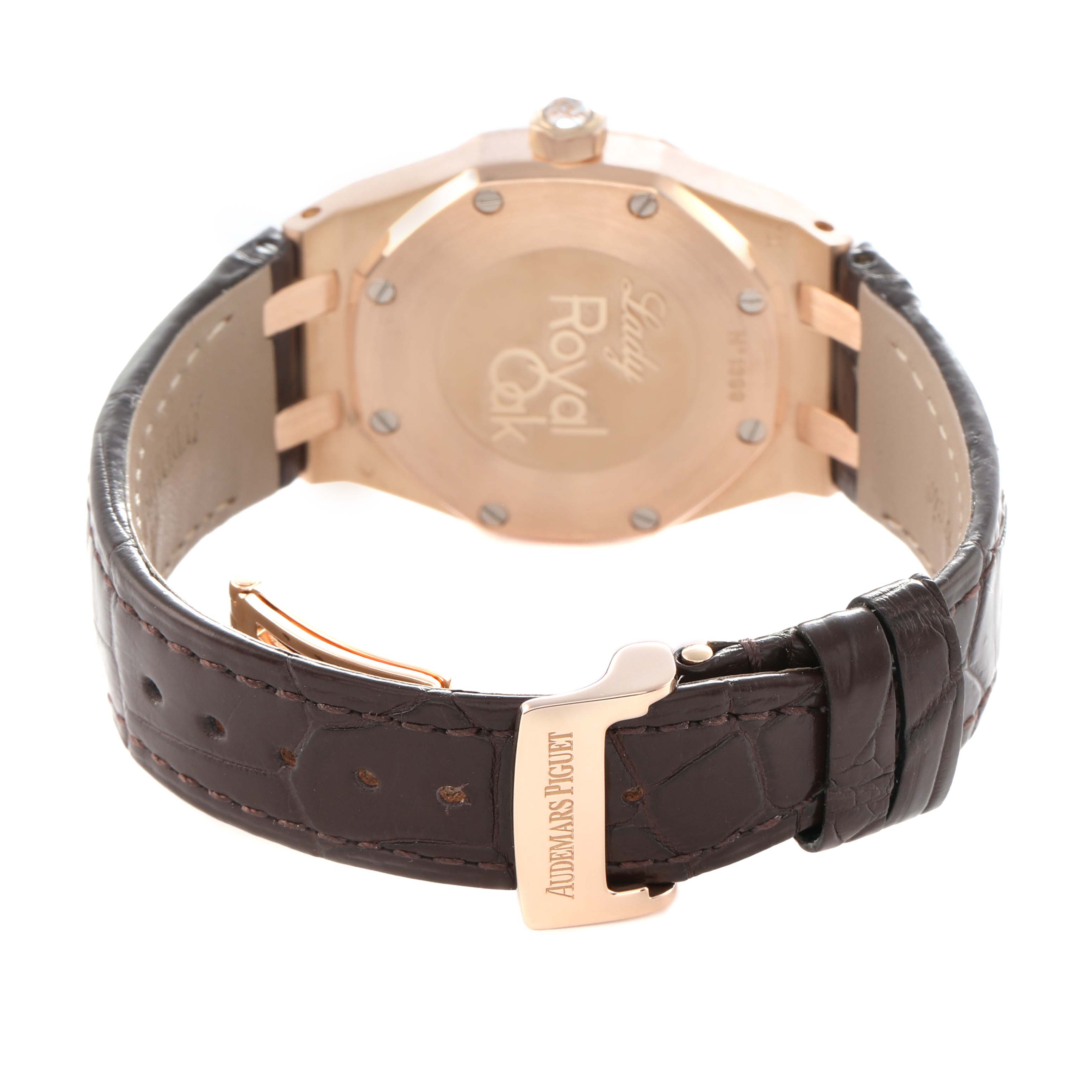 The image shows the back of a Royal Oak model by Audemars Piguet, highlighting the case back and leather strap with the clasp.