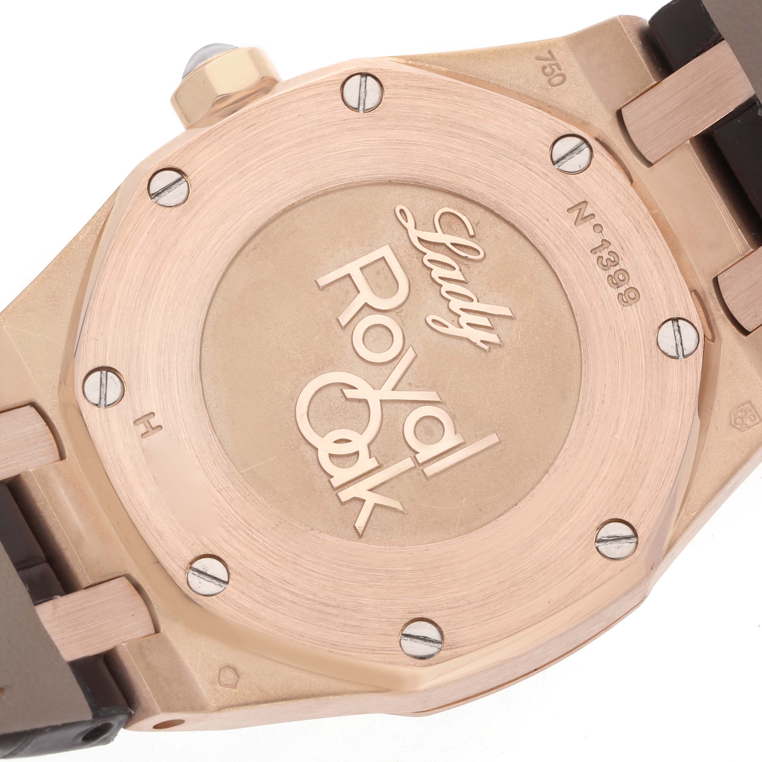 The image shows the back case of an Audemars Piguet Lady Royal Oak watch, highlighting the engraved model name and bezel screws.