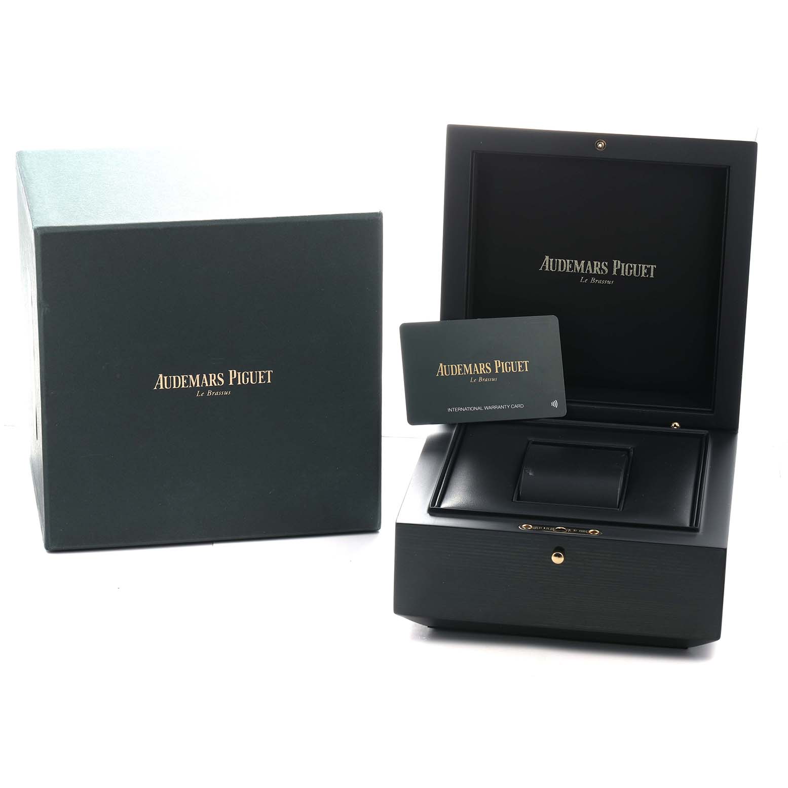 The image shows packaging for the Audemars Piguet Royal Oak 77450ST.OO.1361ST.01 Men's Stainless Steel Silver Dial, including a presentation box, warranty card, and outer box.