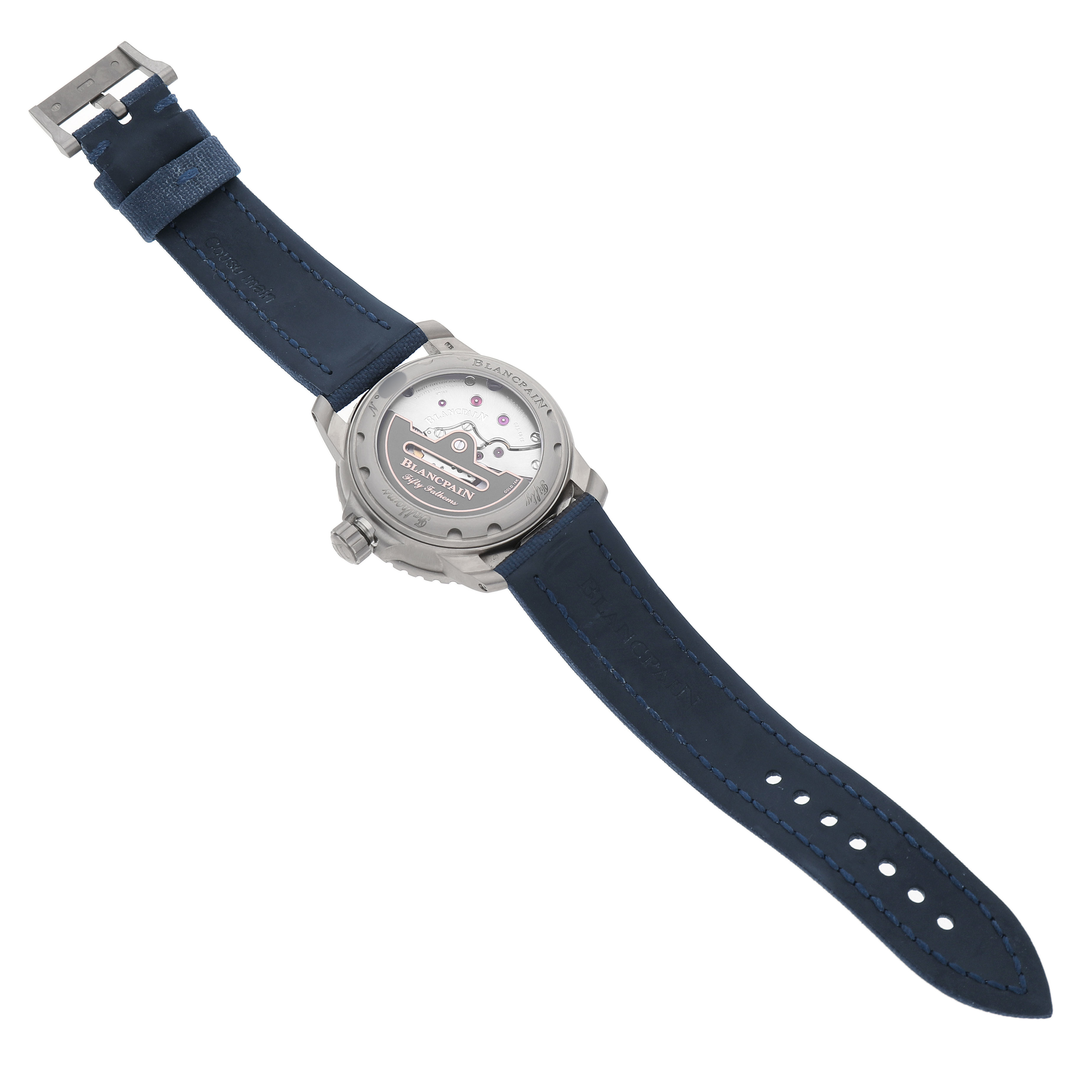 The Blancpain Fifty Fathoms 5010-12B40-O52A Men's Titanium Blue Dial watch is shown from the back, displaying its movement and blue strap.
