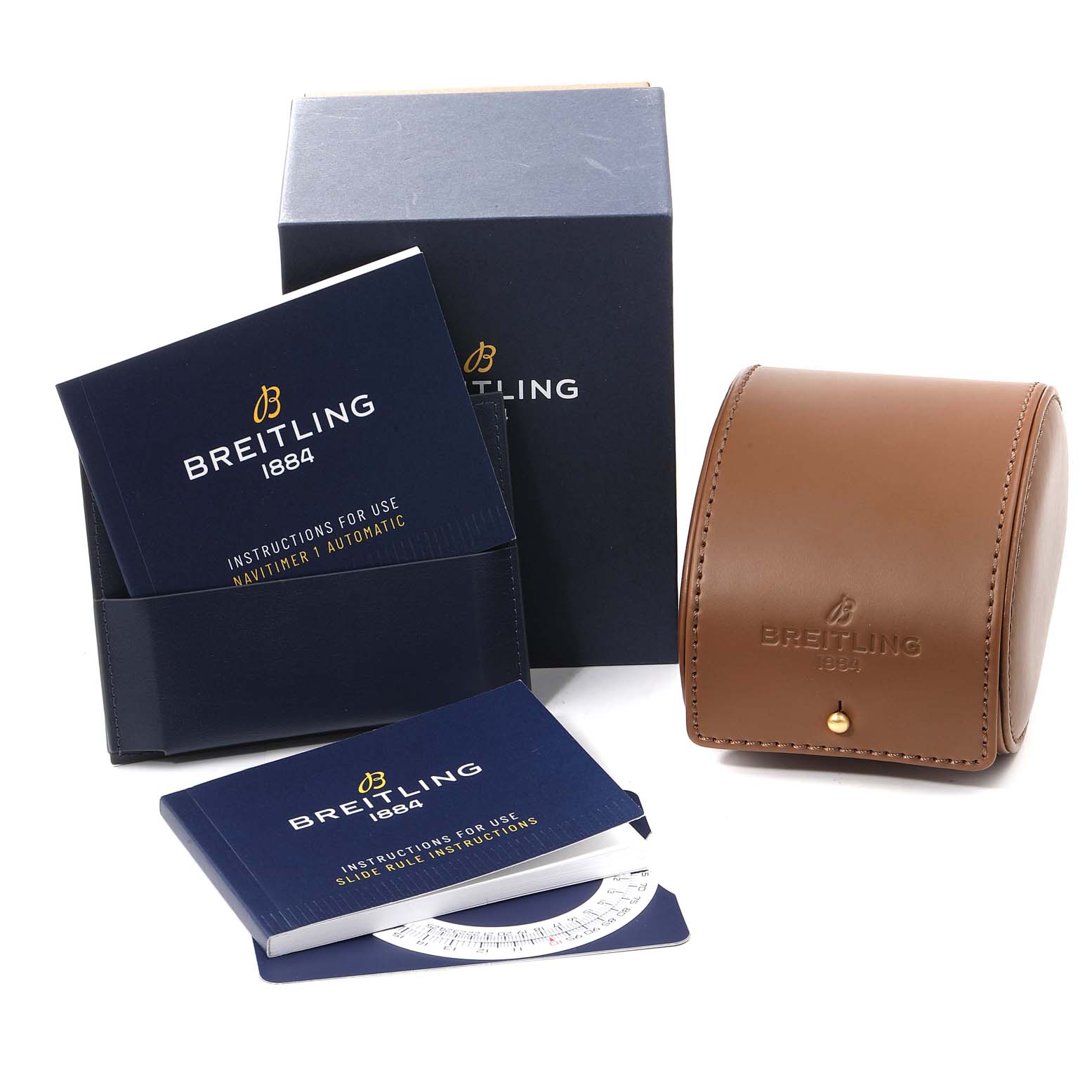 The image shows a Breitling Navitimer AB0121 Men
s Stainless Steel Black Dial AB0121 Men
s Stainless Steel Black Dial model box, instruction manuals, and a tan leather watch case.