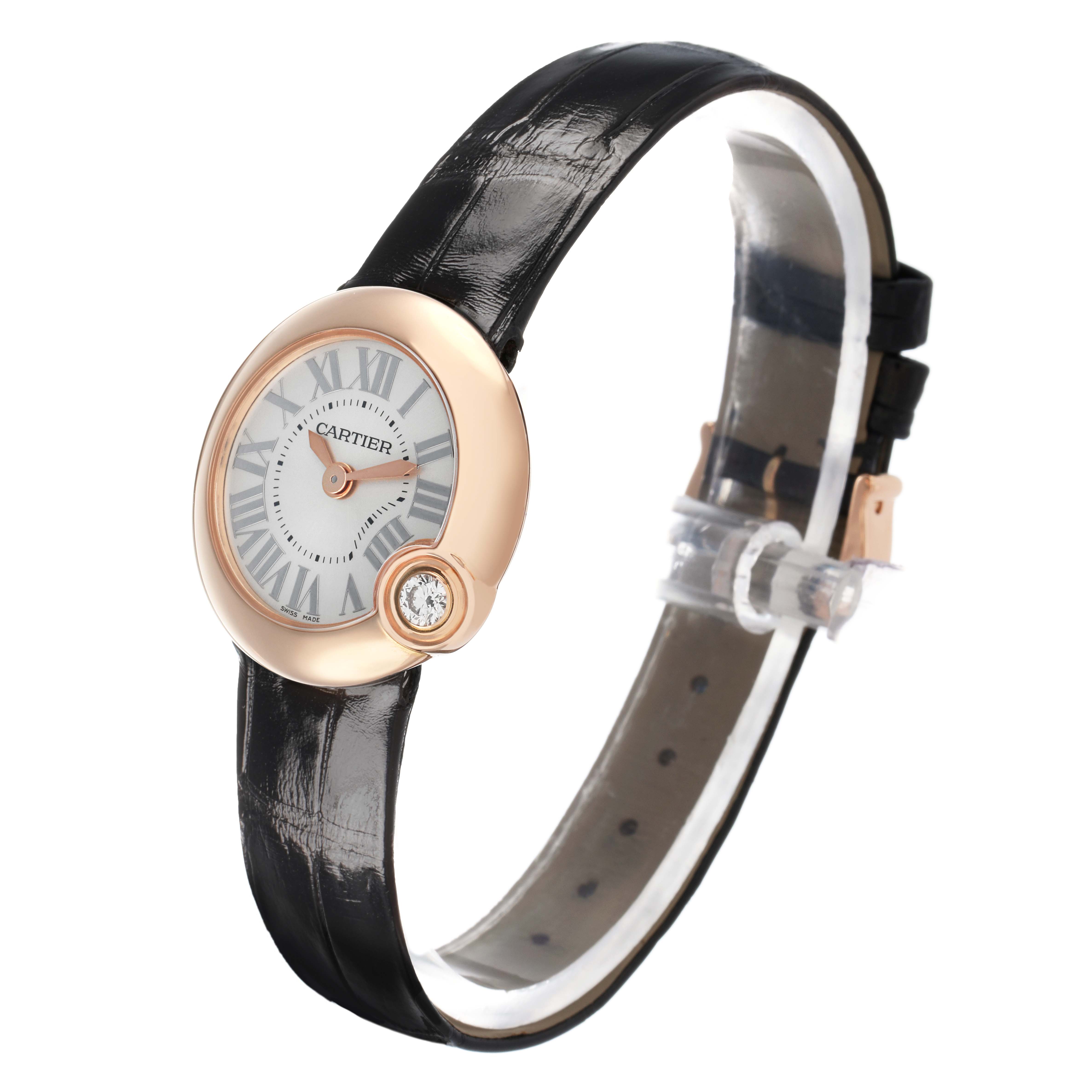 The Cartier Ballon Blanc WGBL0002 Women's Rose Gold Silver Dial watch is shown at an angle highlighting the face, diamond, strap, and buckle.