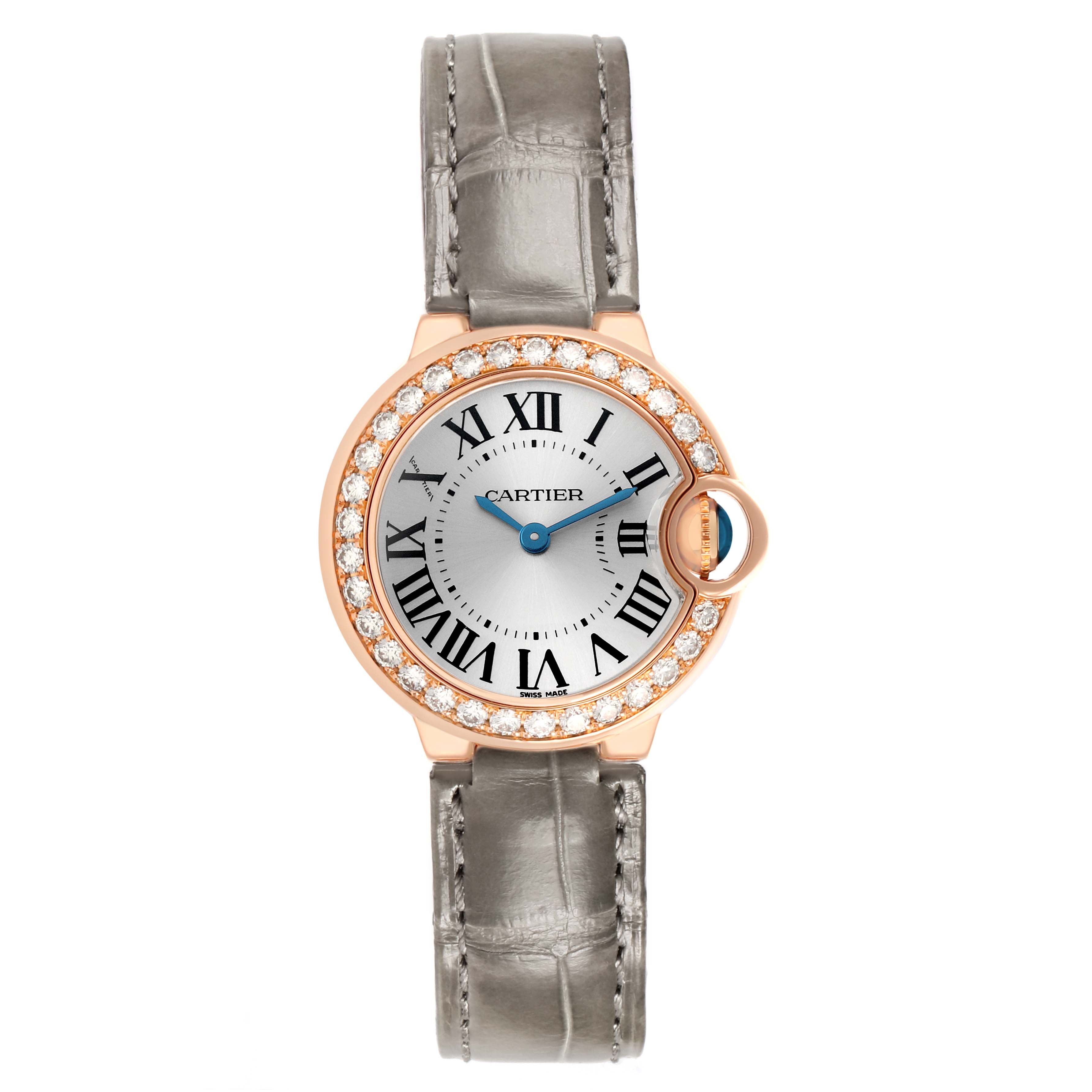 The Cartier Ballon Bleu WE900251 Women's Rose Gold Silver Dial watch is shown from a top-down view, highlighting its diamond bezel, silver dial, and gray leather strap.