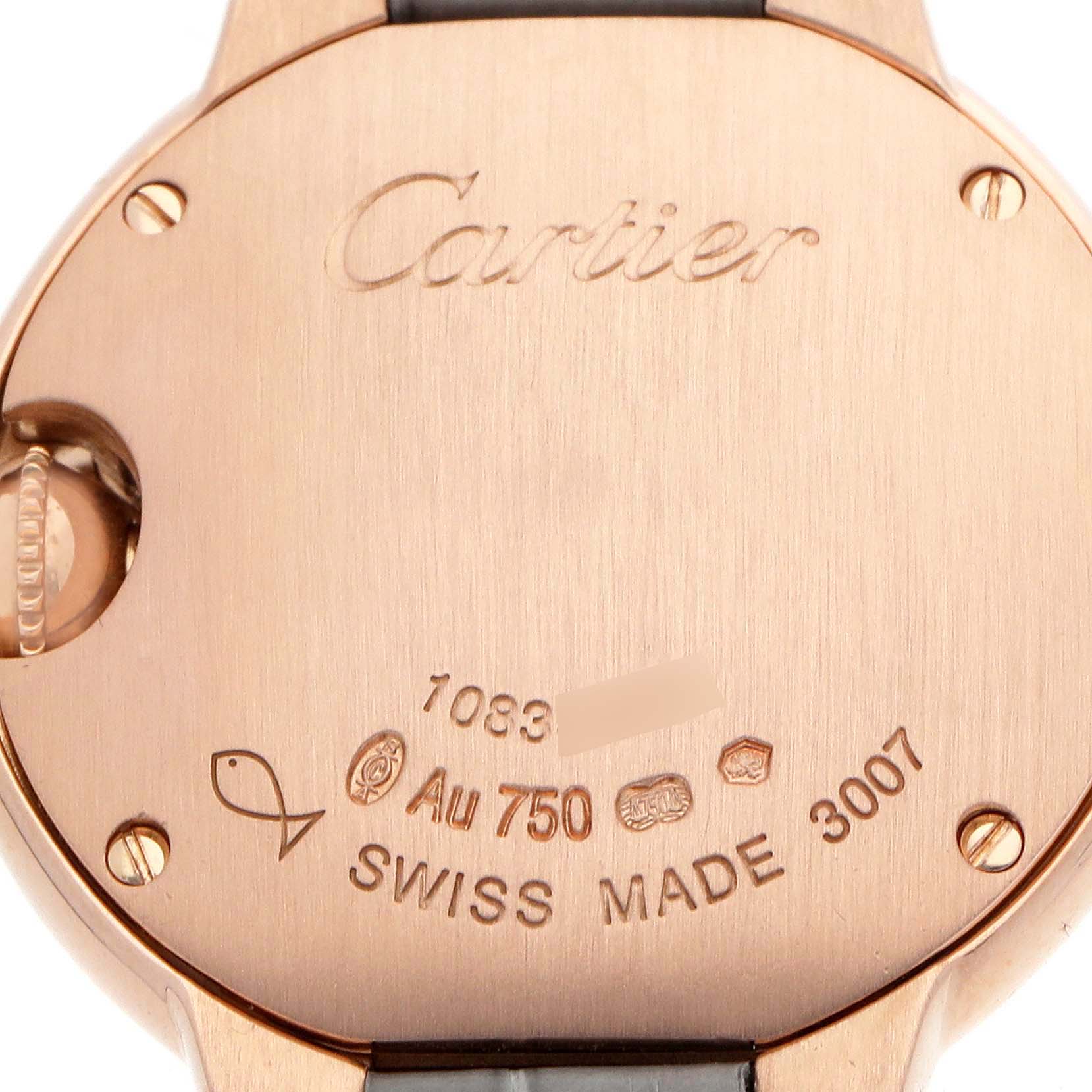 The image shows the back of the Cartier Ballon Bleu WE900251 Women's Rose Gold Silver Dial watch, detailing the brand engraving and hallmark markings.