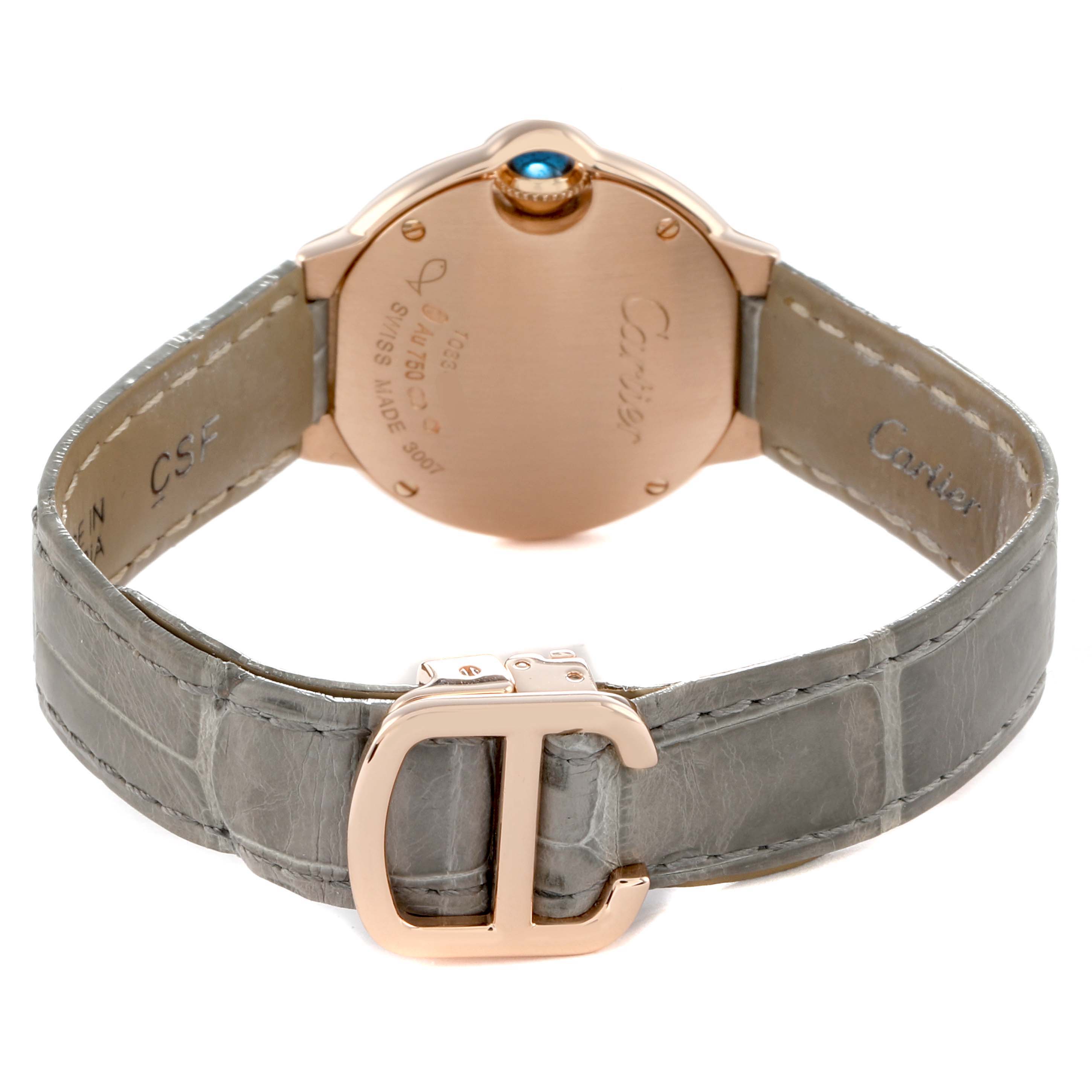 The image shows the back of a Ballon Bleu de Cartier watch, featuring the backside of the case, crown, and the strap with a buckle.