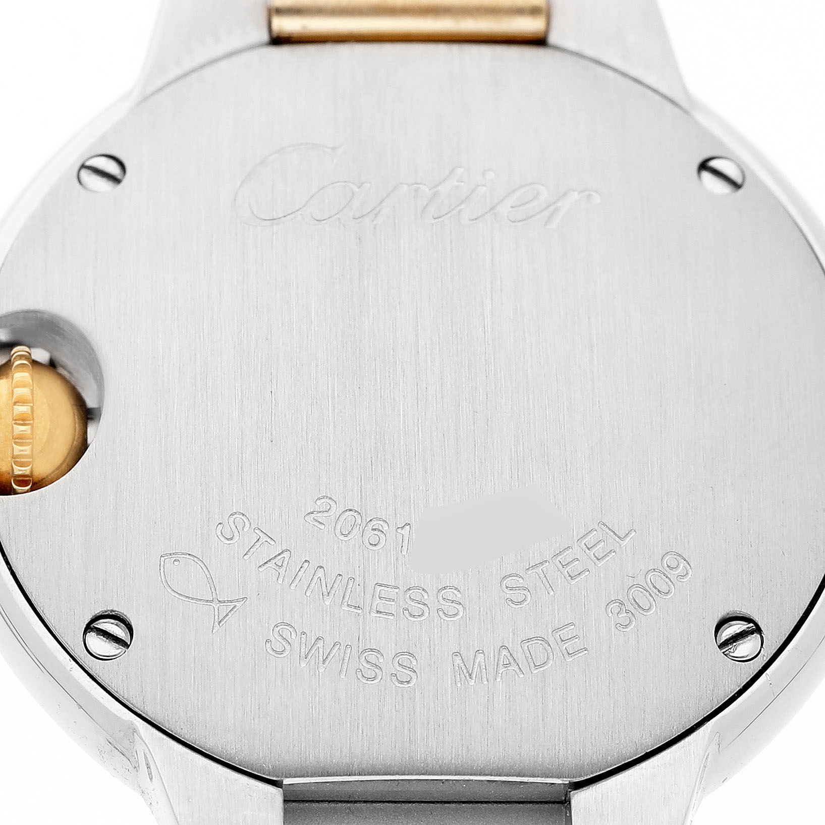 The image shows the back of a Ballon Bleu by Cartier watch, featuring the engraved brand name, model number, and crown on the side.