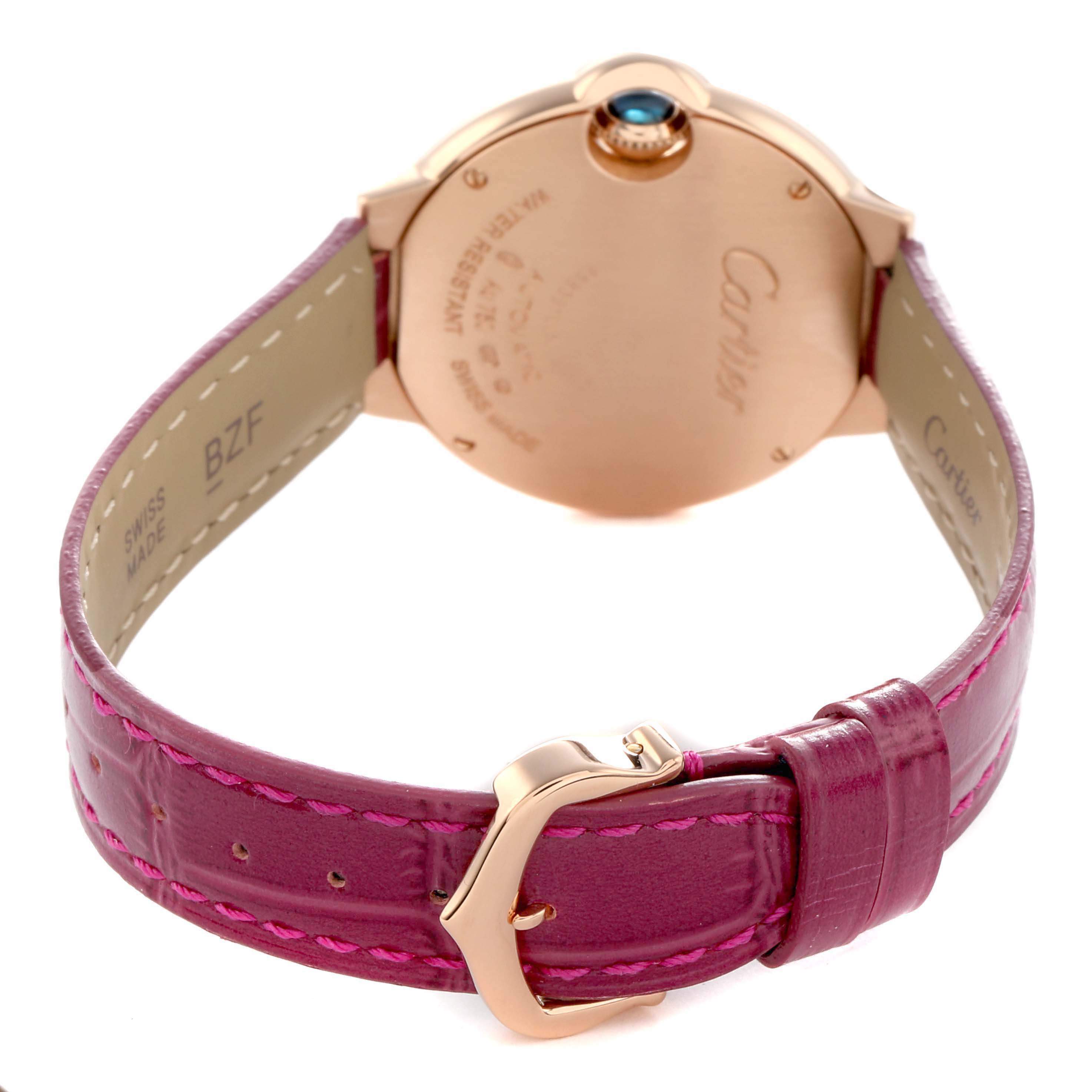 The image shows the back of a Cartier Ballon Bleu WE902063 Women's Rose Gold Silver Dial watch, focusing on the case back, strap, and buckle.