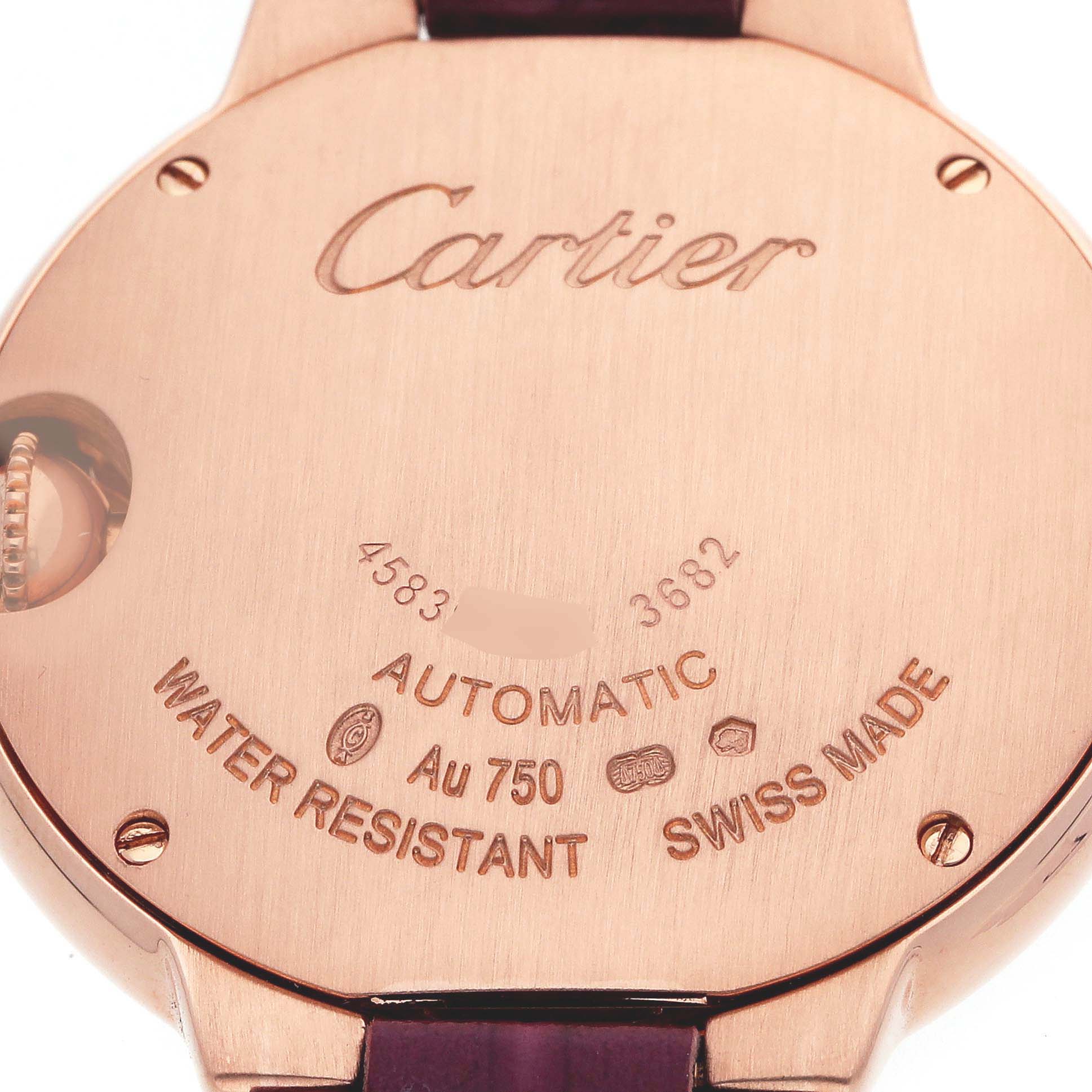 The image shows the back case of a Ballon Bleu model by Cartier, including engravings and the crown side profile.