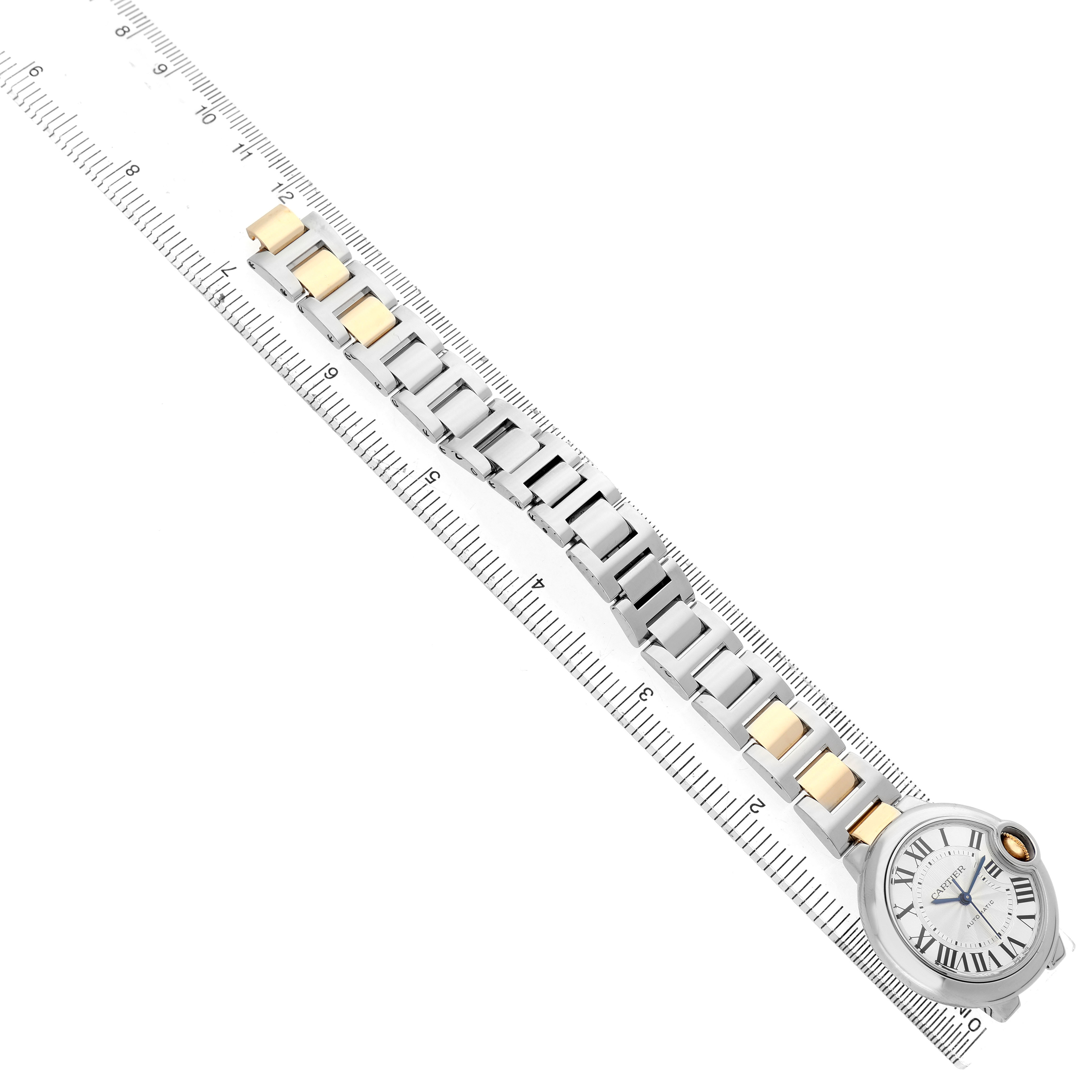 The image shows a side angle of the Cartier Ballon Bleu W2BB0002 Women's Steel and Gold (two tone) Silver Dial watch with a ruler measuring the gold and silver bracelet.