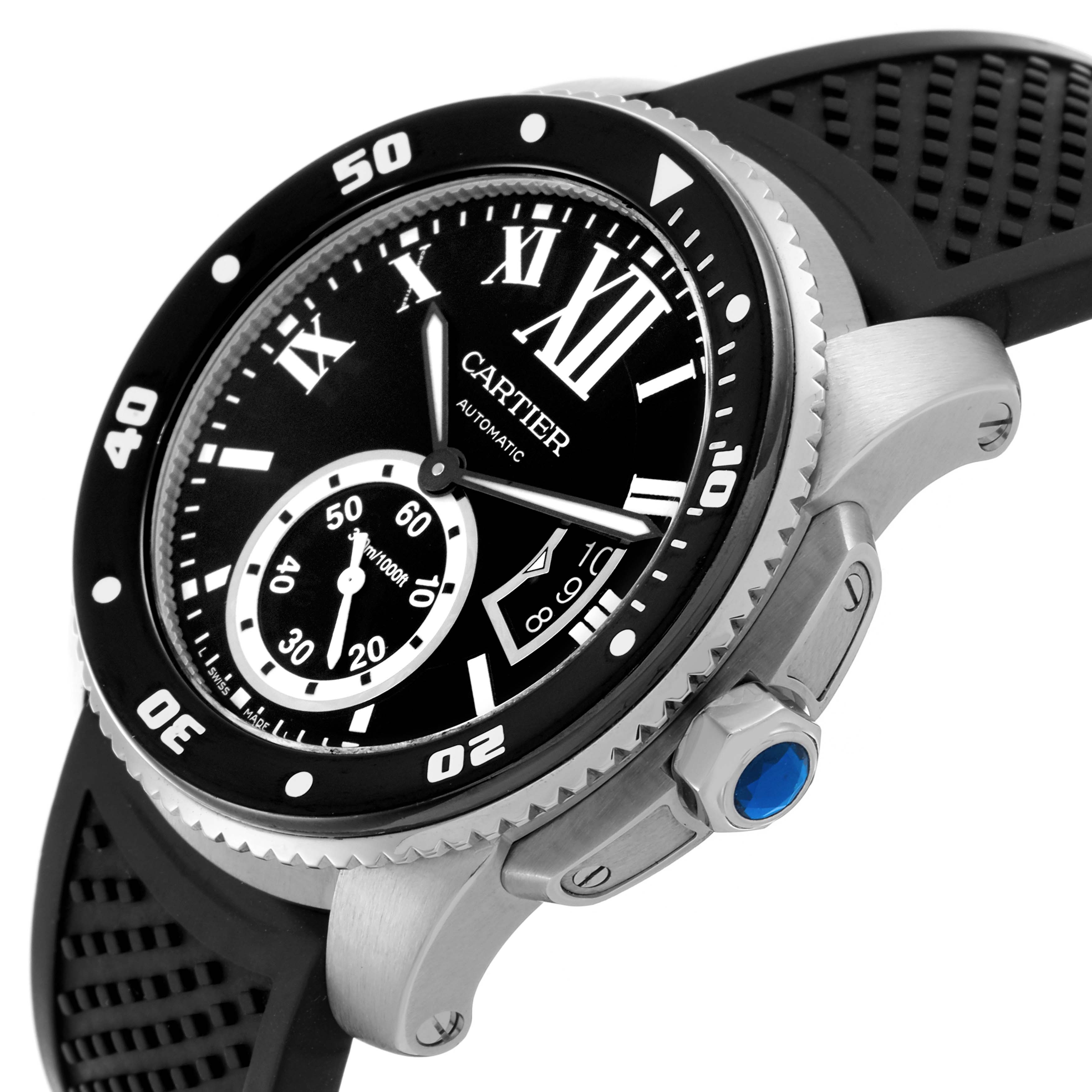 The image shows a side angle of the Calibre de Cartier watch, highlighting the bezel, crown, and rubber strap.