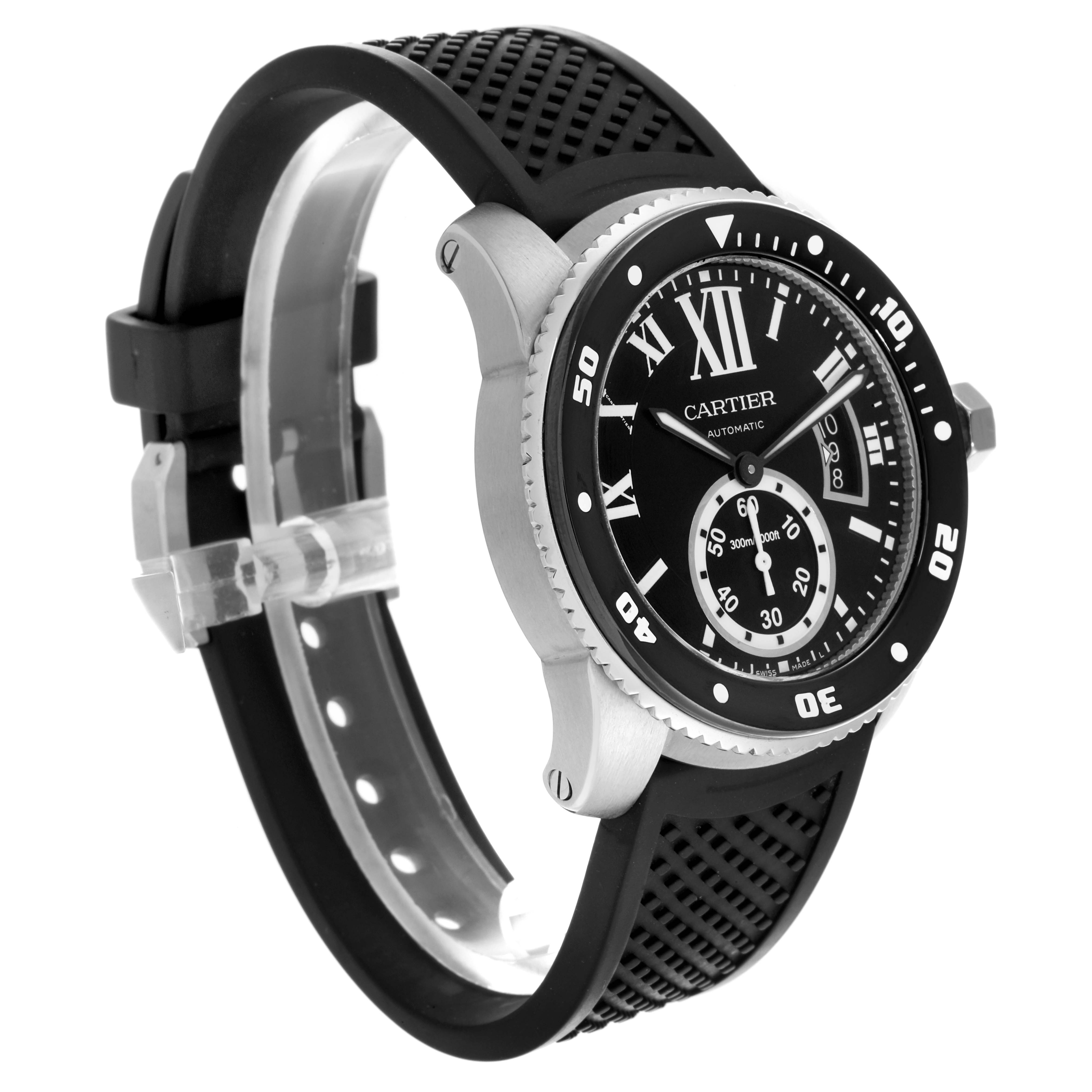 The Calibre de Cartier watch is shown at a three-quarter angle, highlighting the face, bezel, and rubber strap.