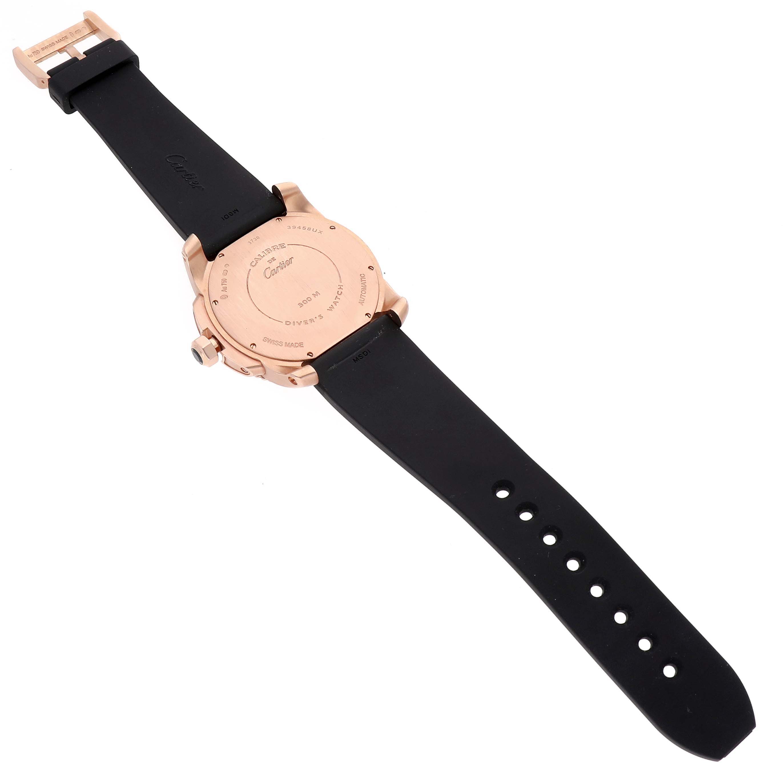 The image shows the back of a Calibre de Cartier watch, highlighting the case back and black strap.