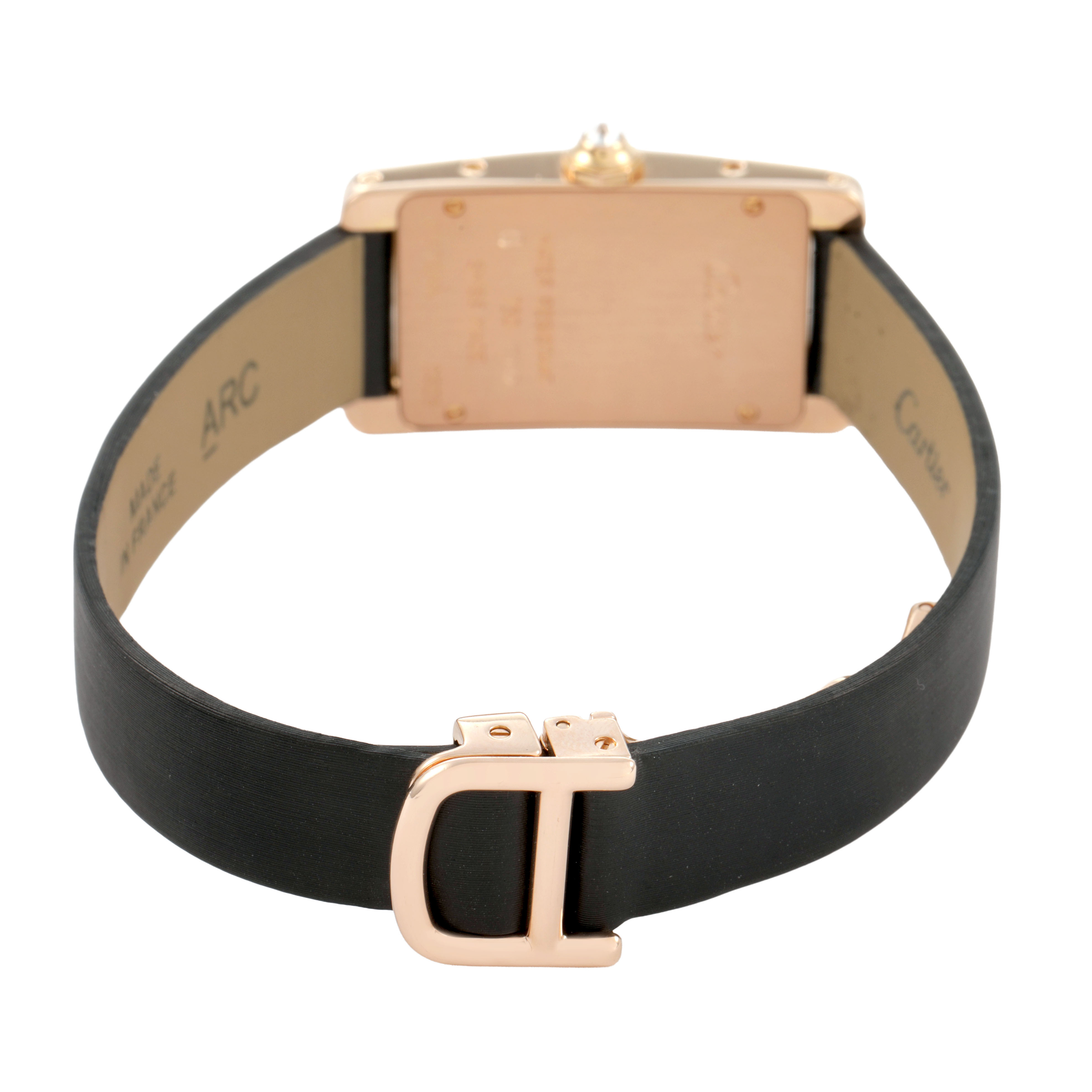 The Cartier Tank Américaine watch is shown from the back, displaying the case back and leather strap with a deployant buckle.