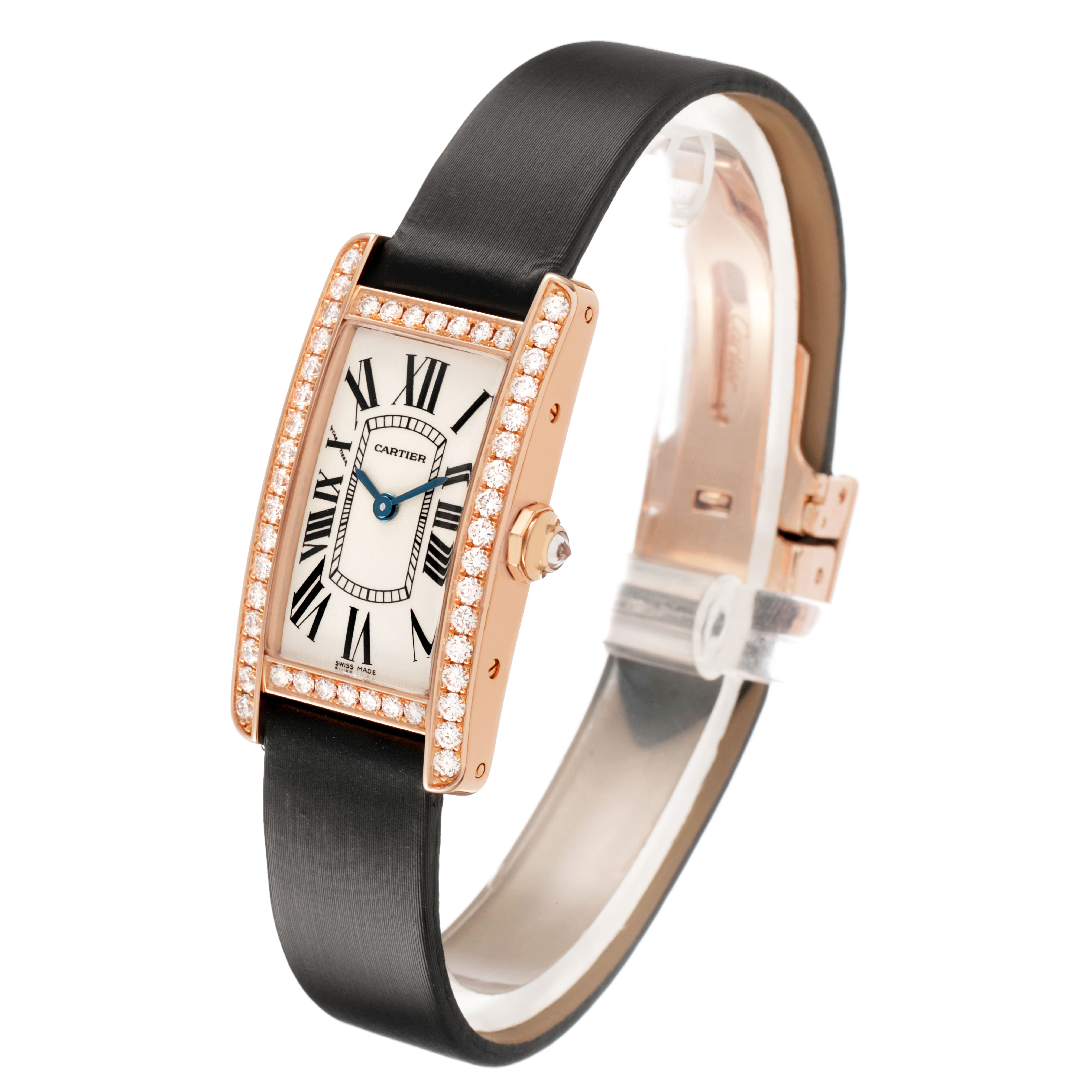 The Cartier Tank Américaine watch is shown at a three-quarter angle, highlighting its rectangular face, diamond bezel, and black strap.
