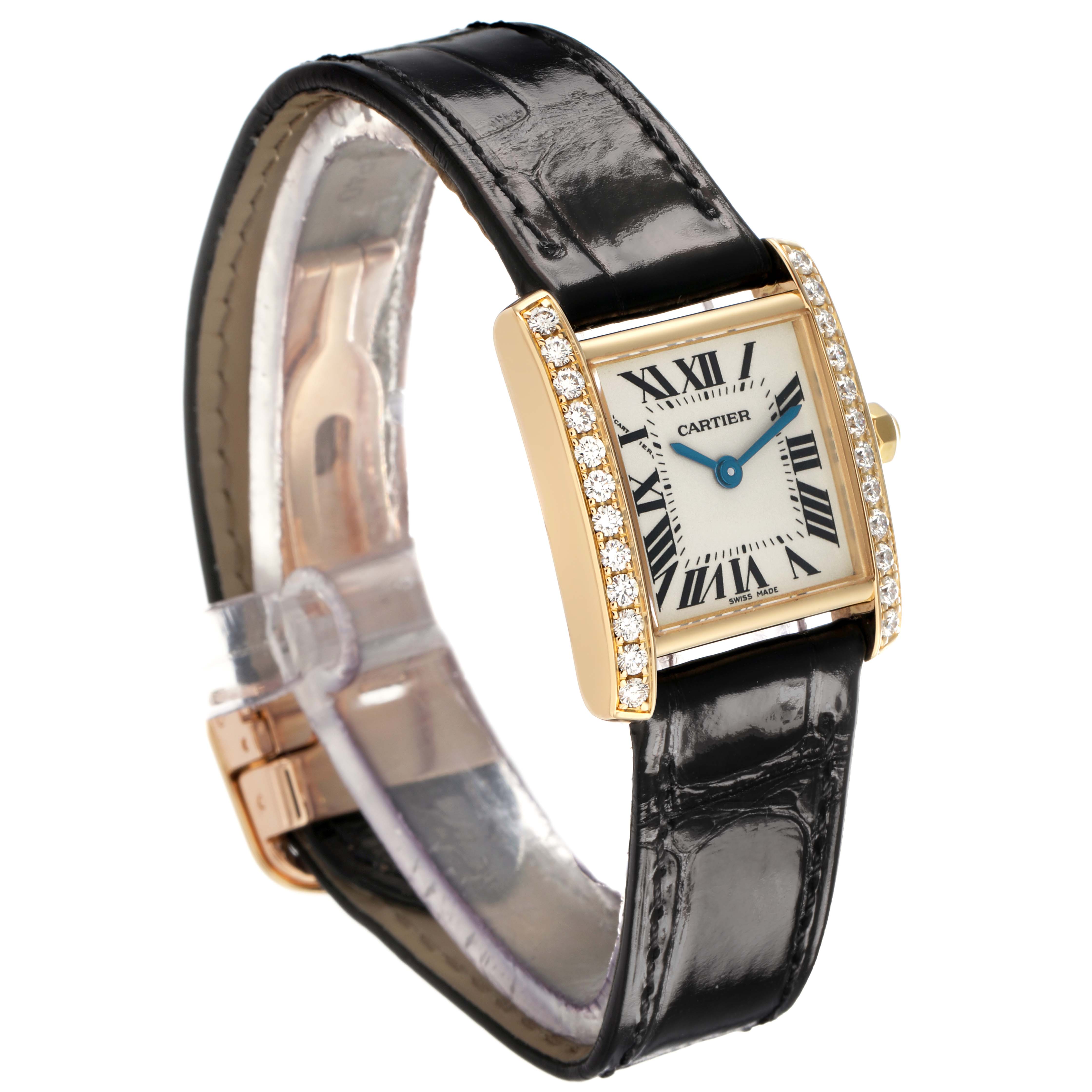 The Cartier Tank Francaise WE100151 Women's Yellow Gold Silver Dial watch is shown at an angled view, highlighting its diamond-encrusted case and black leather strap.