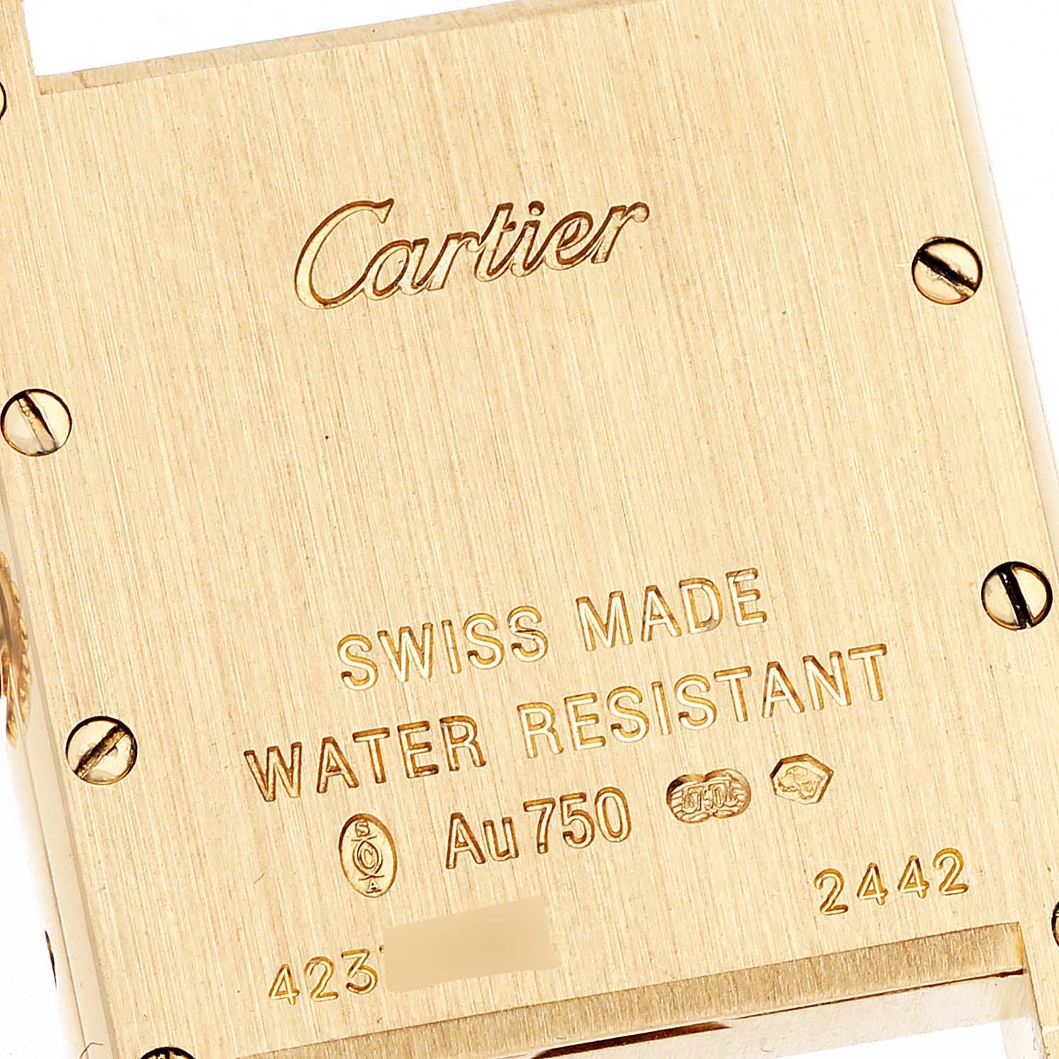 This image shows the back case of the Cartier Tank Louis W1529856 Women's Yellow Gold Silver Dial W1529856 Women's Yellow Gold Silver Dial watch, displaying the brand name, material, and other specifications.