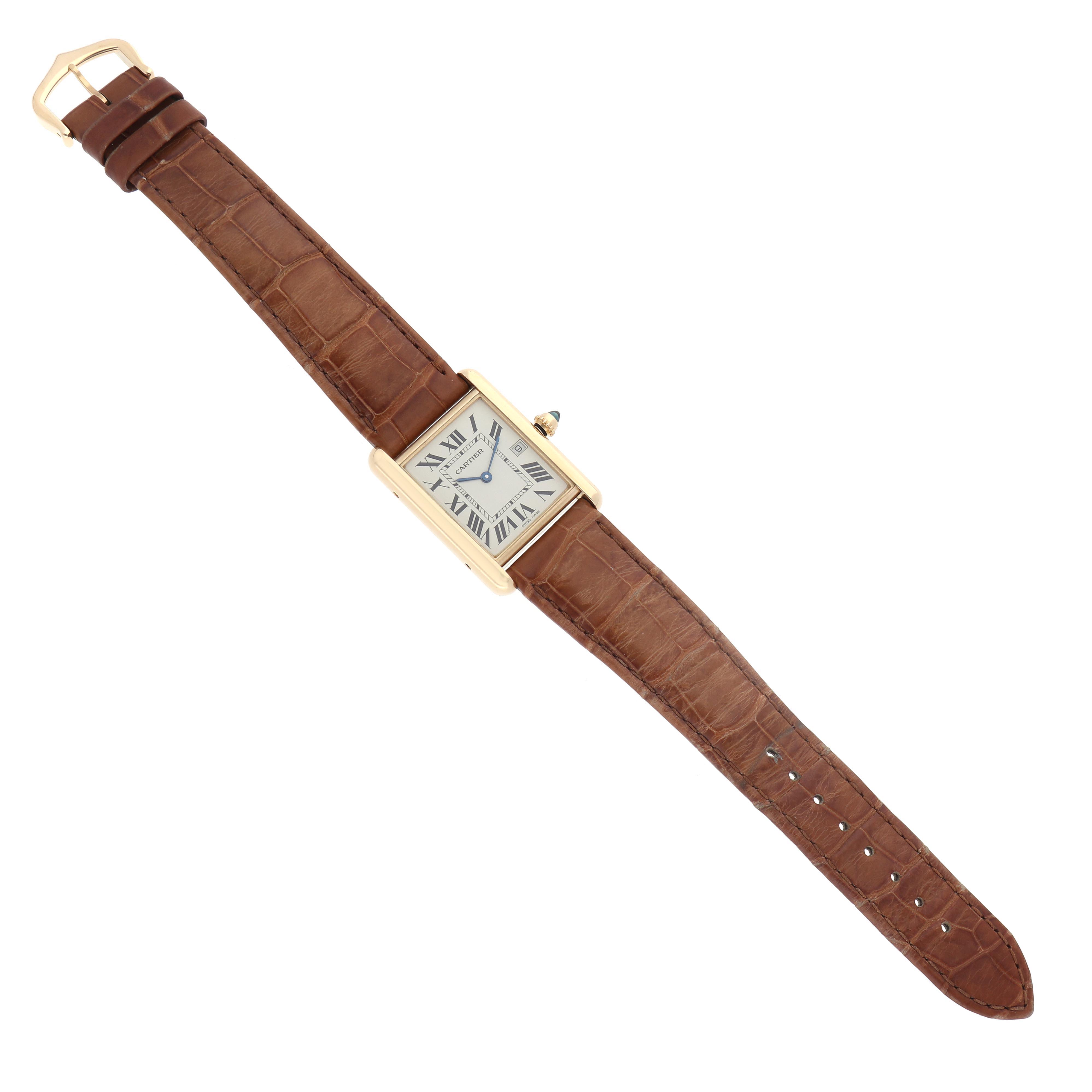 The Cartier Tank Louis W1529756 Men's Yellow Gold Silver Dial watch is shown from a top-down angle, showcasing the face, case, strap, and buckle.