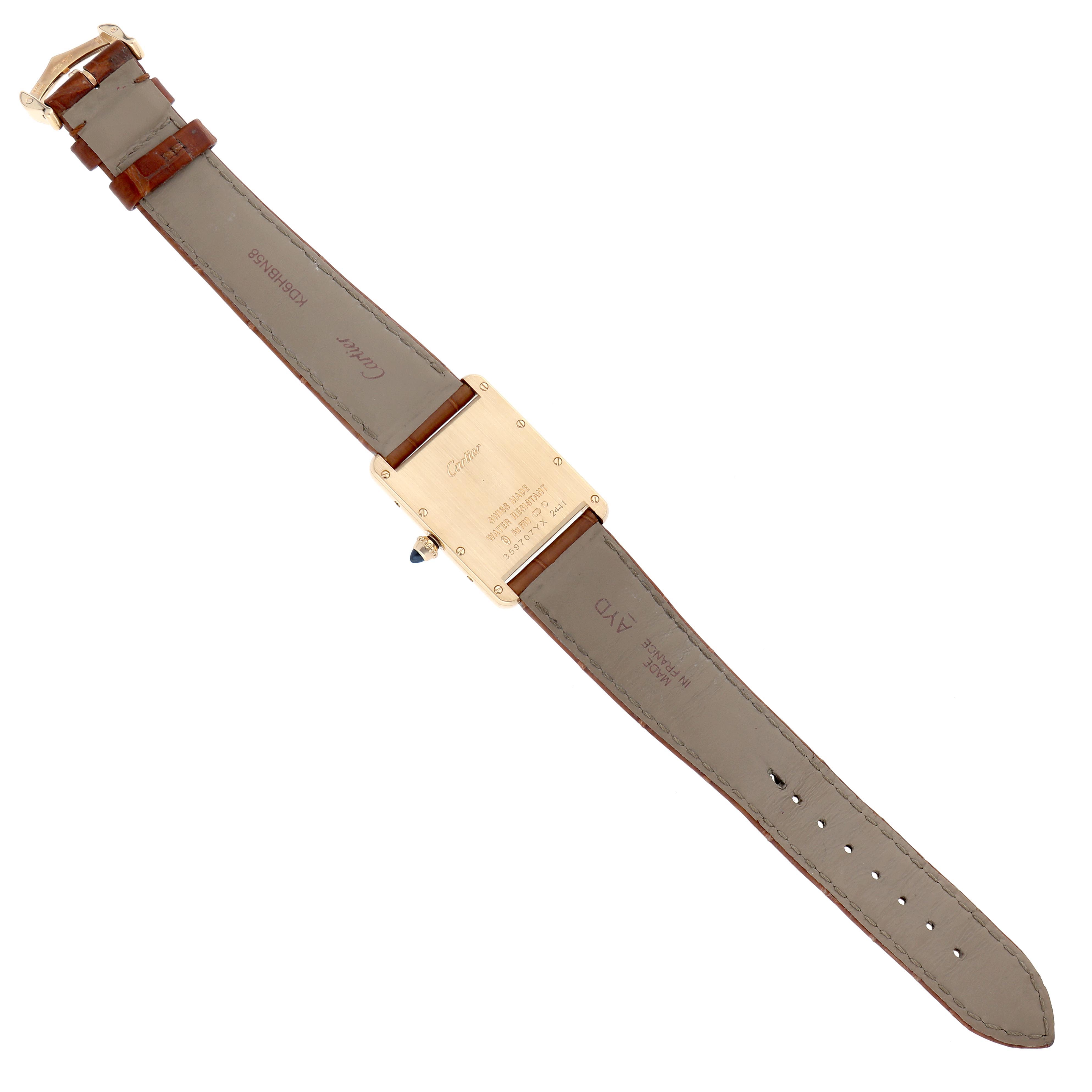 The image shows the back view of the Cartier Tank Louis W1529756 Men's Yellow Gold Silver Dial watch, highlighting the case back and leather strap.